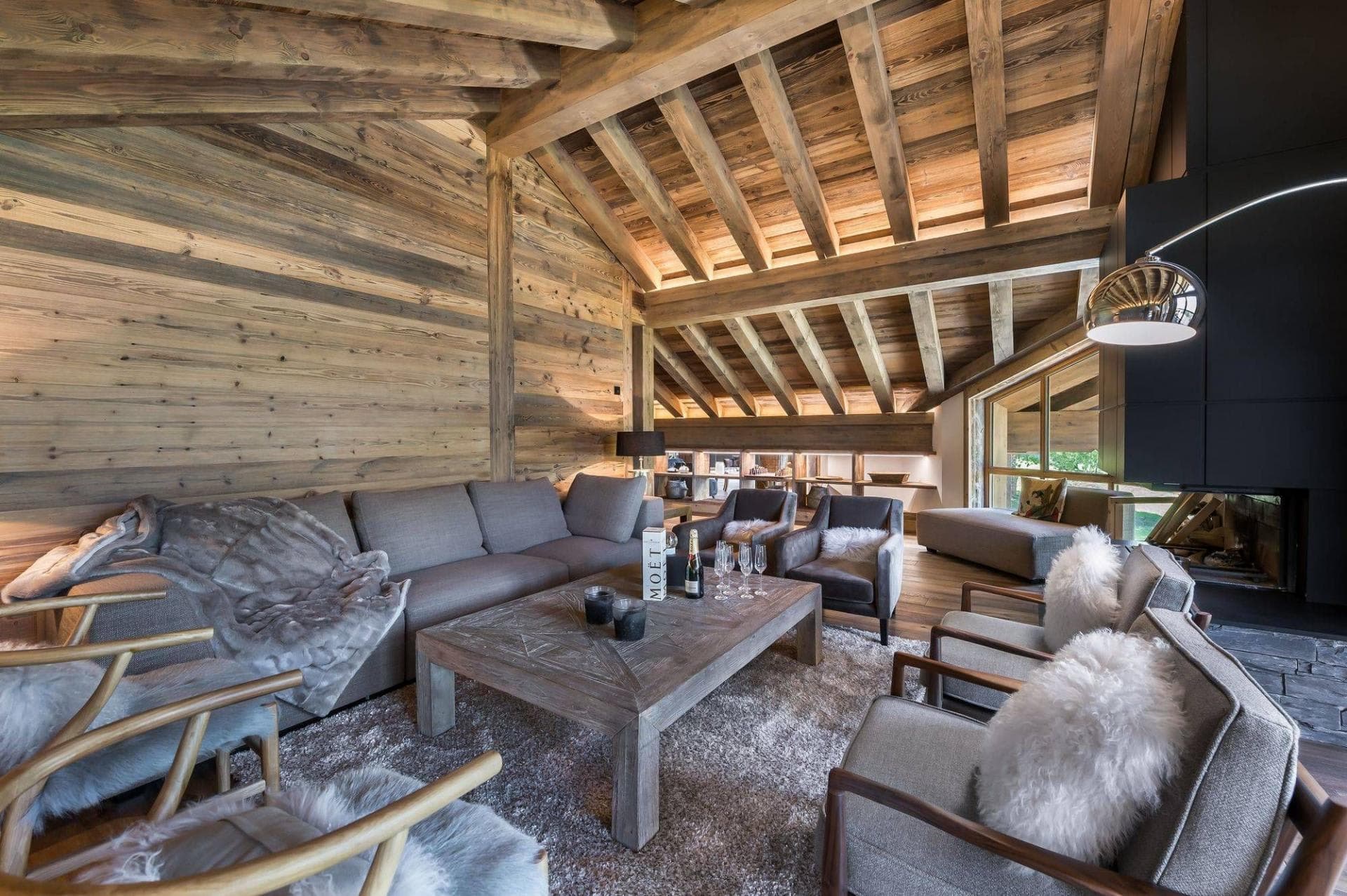 Living room with vaulted timber ceilings and seating for 10