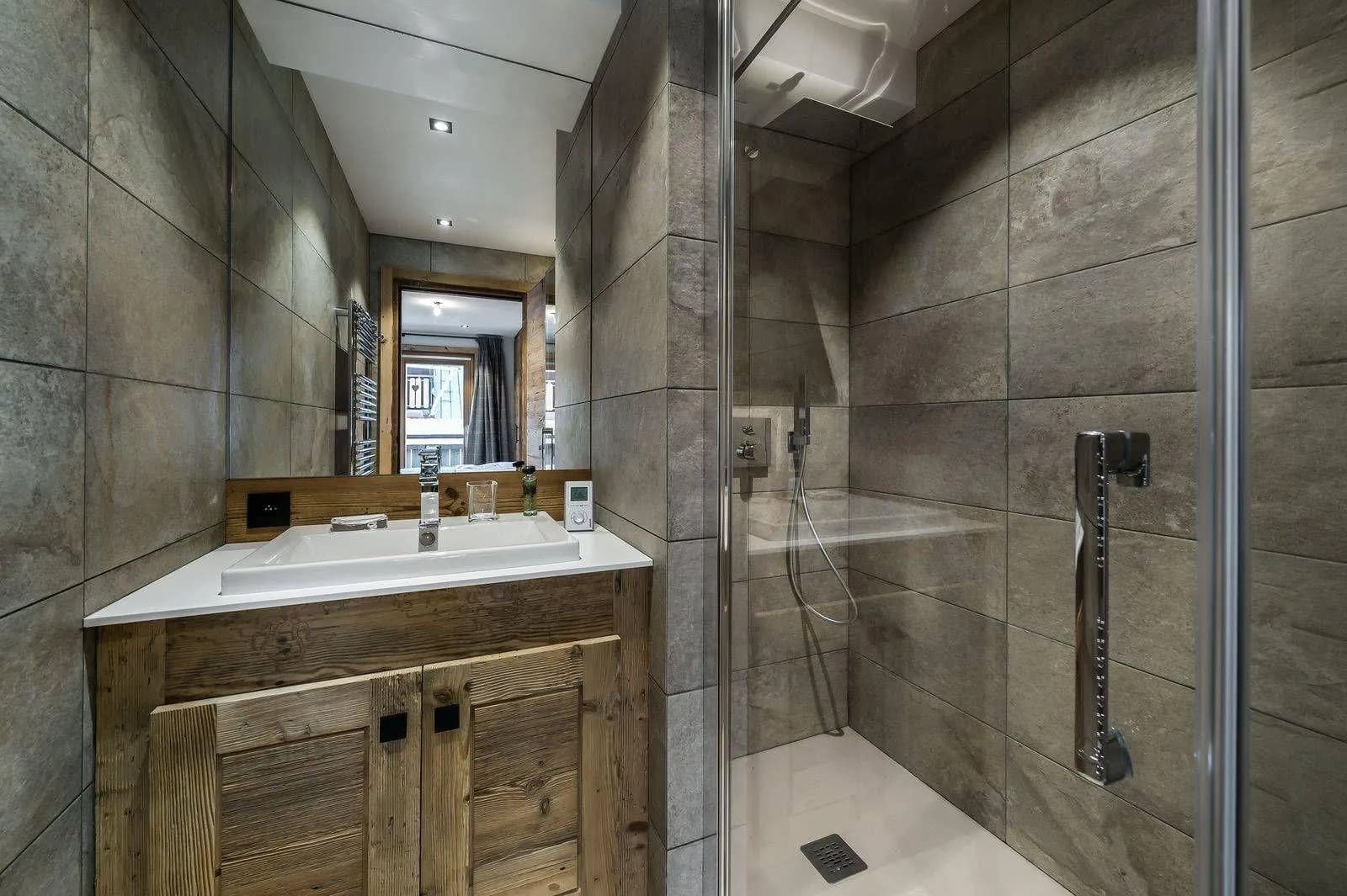 Shower room with basin and towel rail