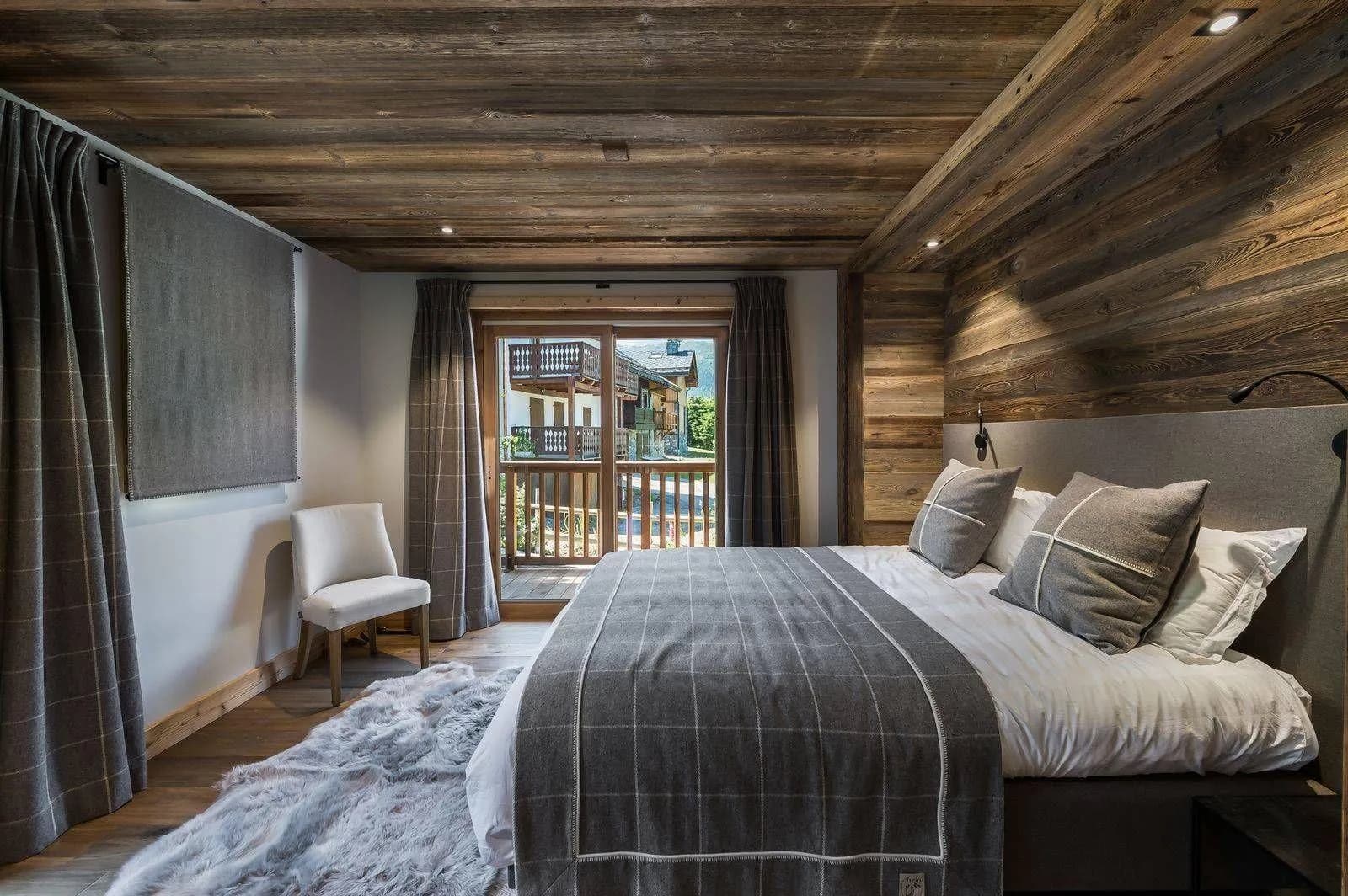 Twin sleeping arrangement beside wardrobe and bedside lighting