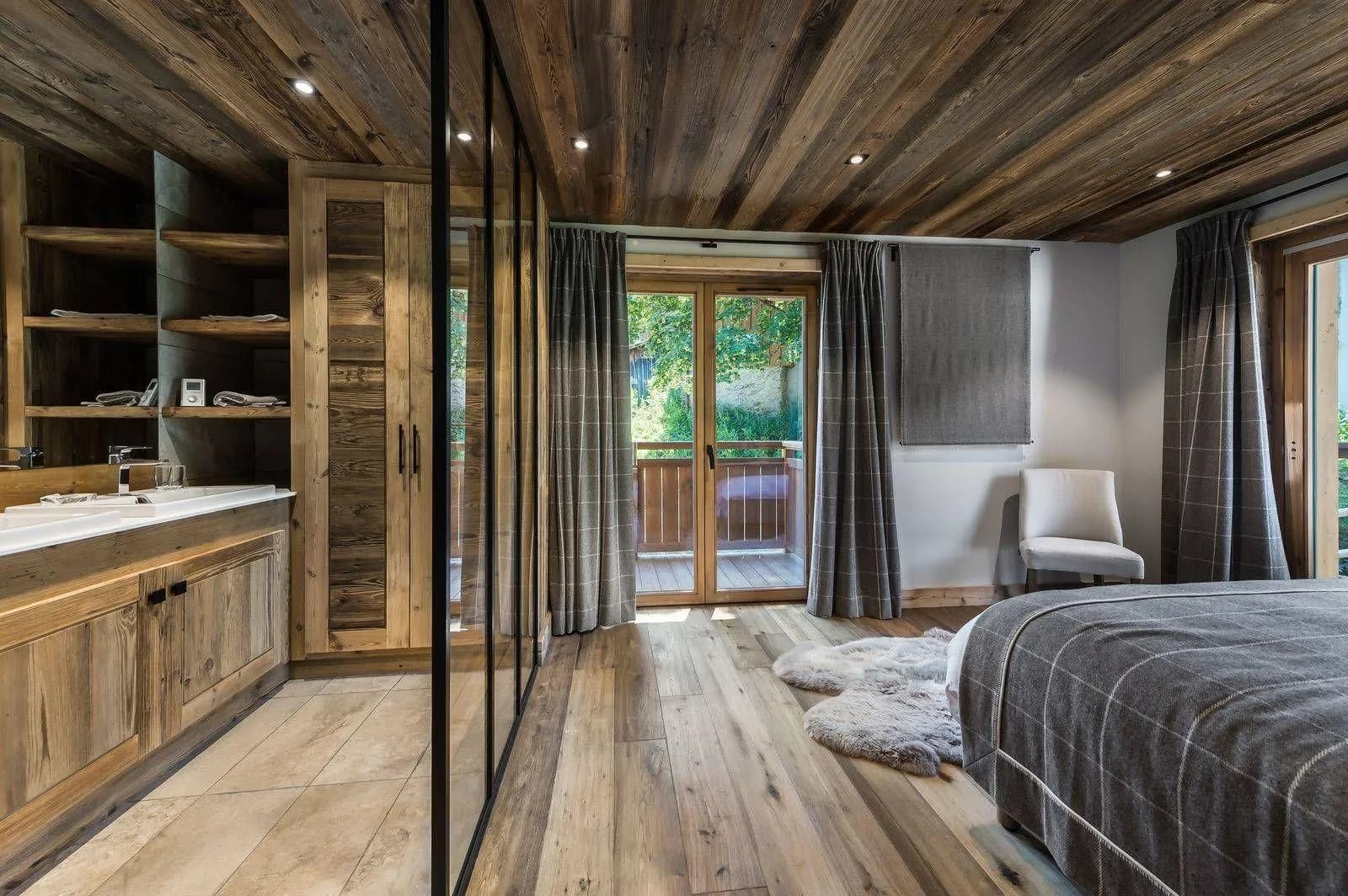 Twin sleeping arrangement with balcony doors and timber panels