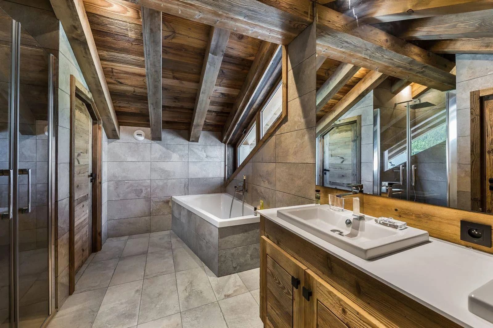 Bathroom with bathtub, walk-in shower and vanity counter