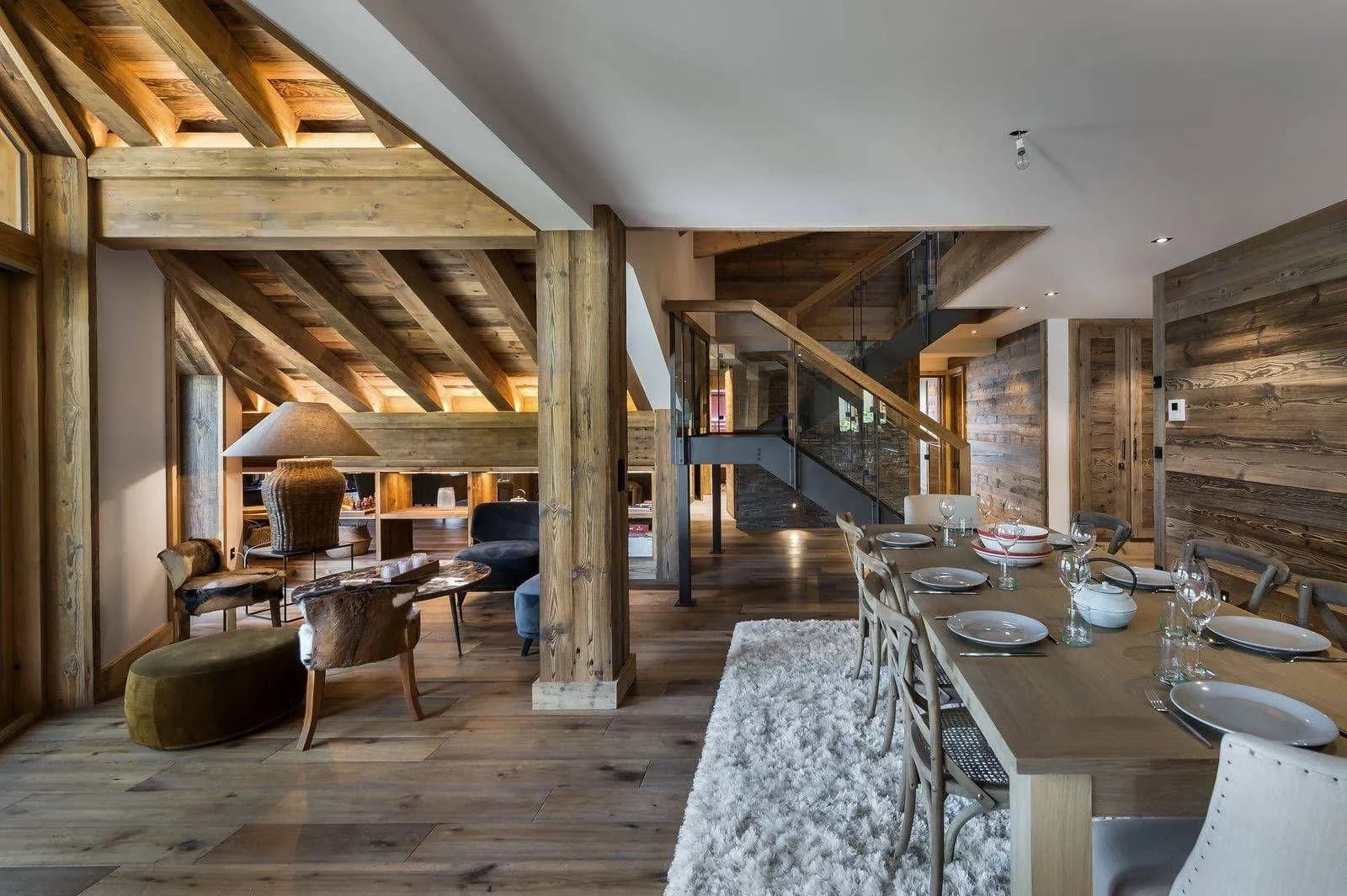 Living and dining spaces with central fireplace