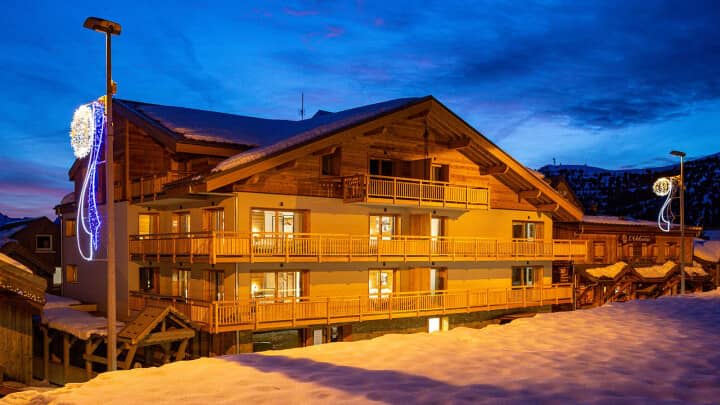 Ski-in/ski-out chalet exterior with private balconies and mountain views