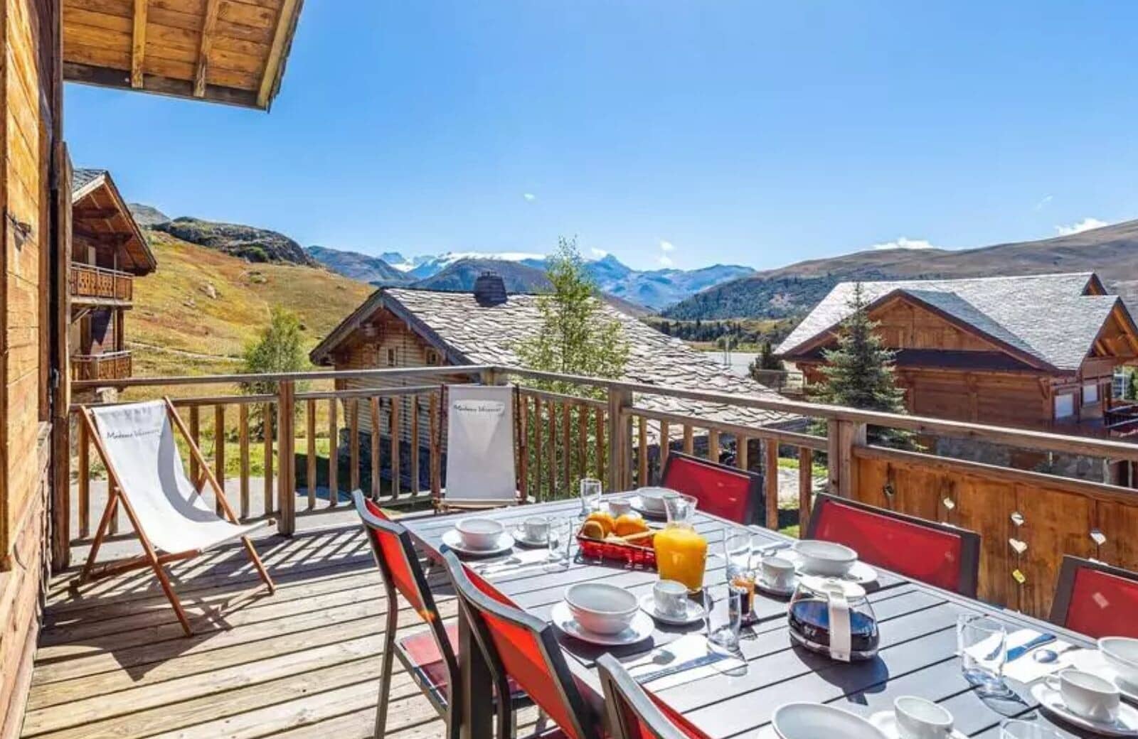 Private wooden balcony with mountain-view dining for 8 people