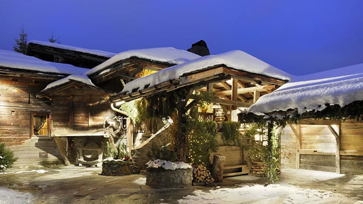 Chalet entrance with heated stone patio and covered timber porch
