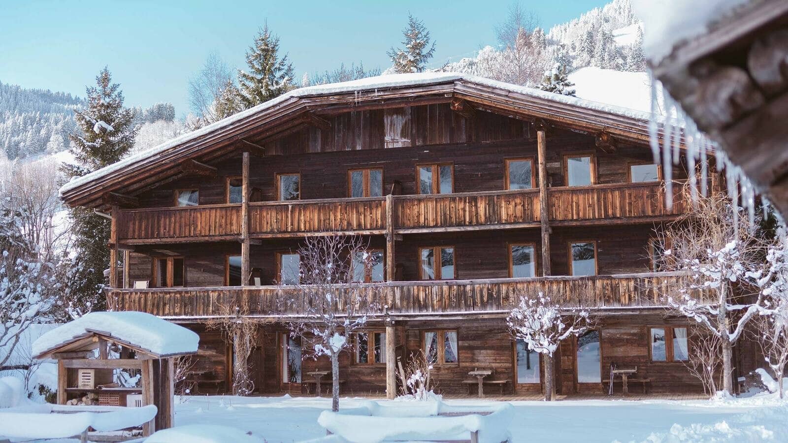 Timber chalet with wraparound balconies and mountain views