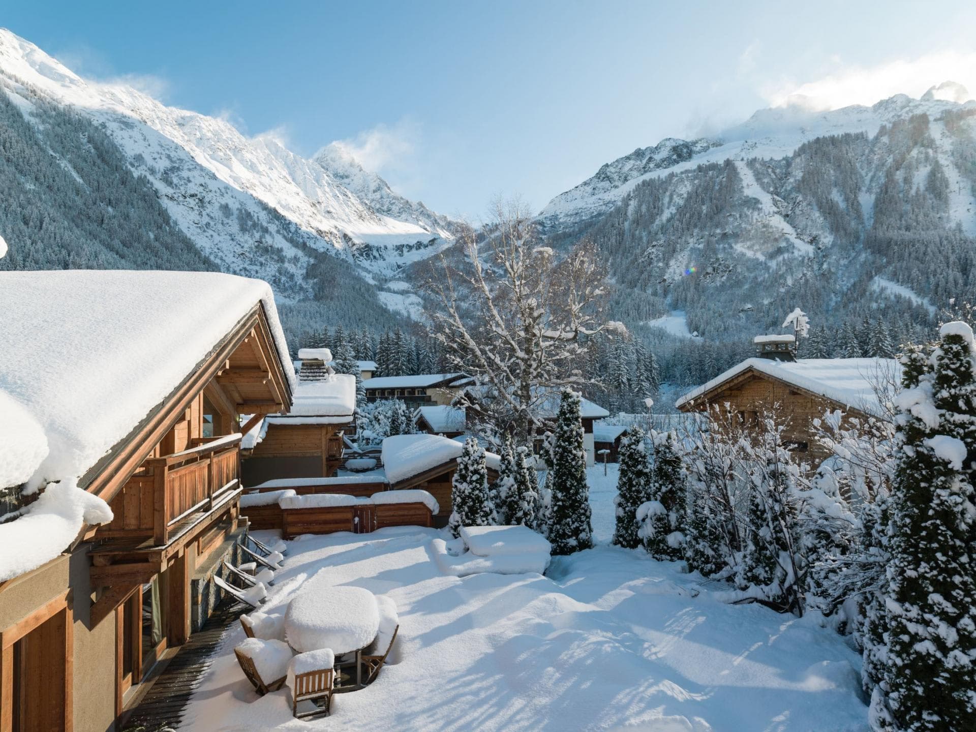 Private snow-covered terrace with outdoor seating and Mont Blanc massif views