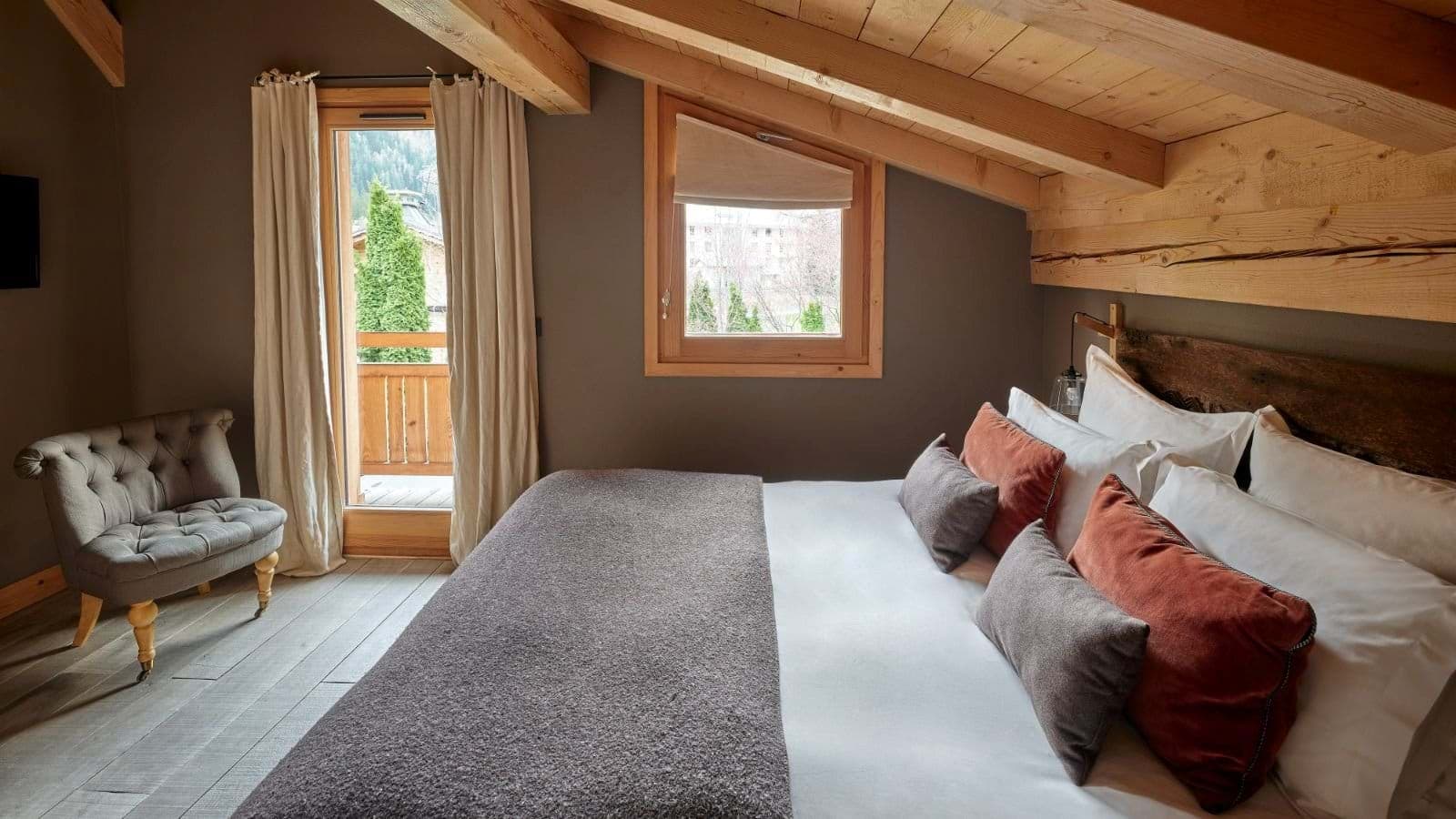 Loft bedroom with king bed and private balcony access