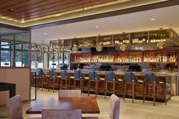 Full-service bar with seating for 10 and table dining