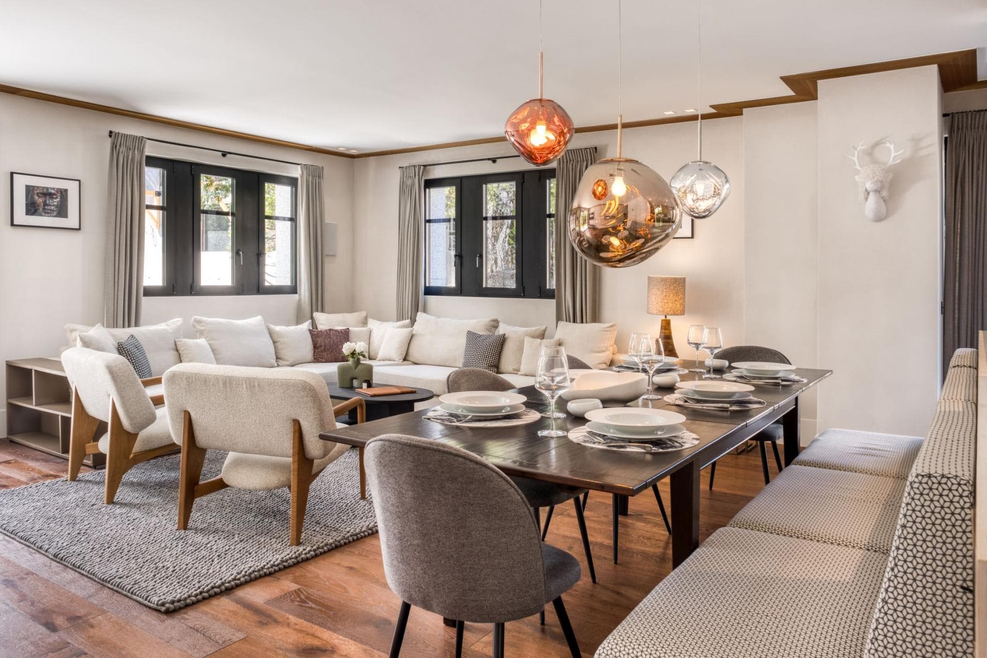 Dining table seats 10; open-plan layout with large sectional sofa