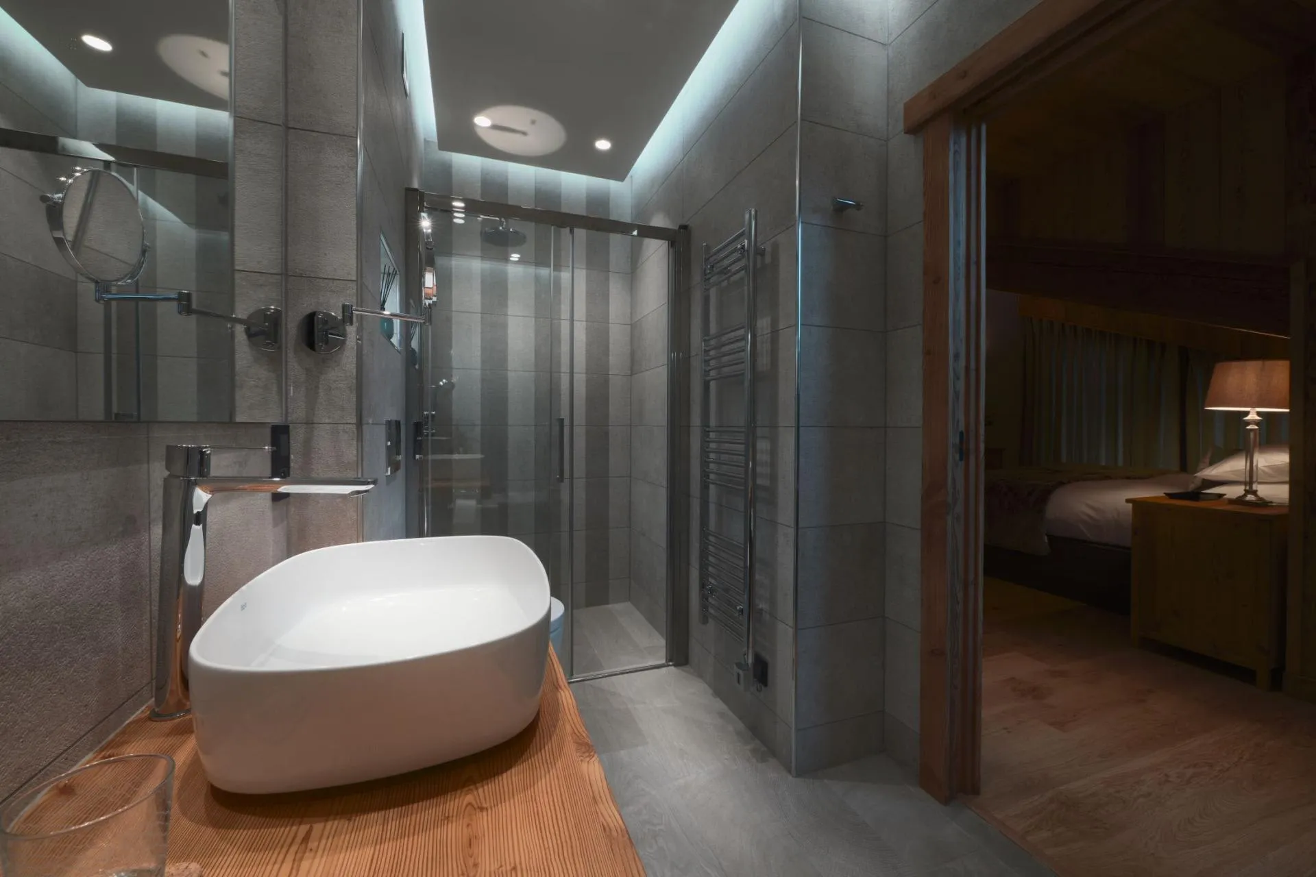 Ensuite bathroom with walk-in rainfall shower and heated towel rack