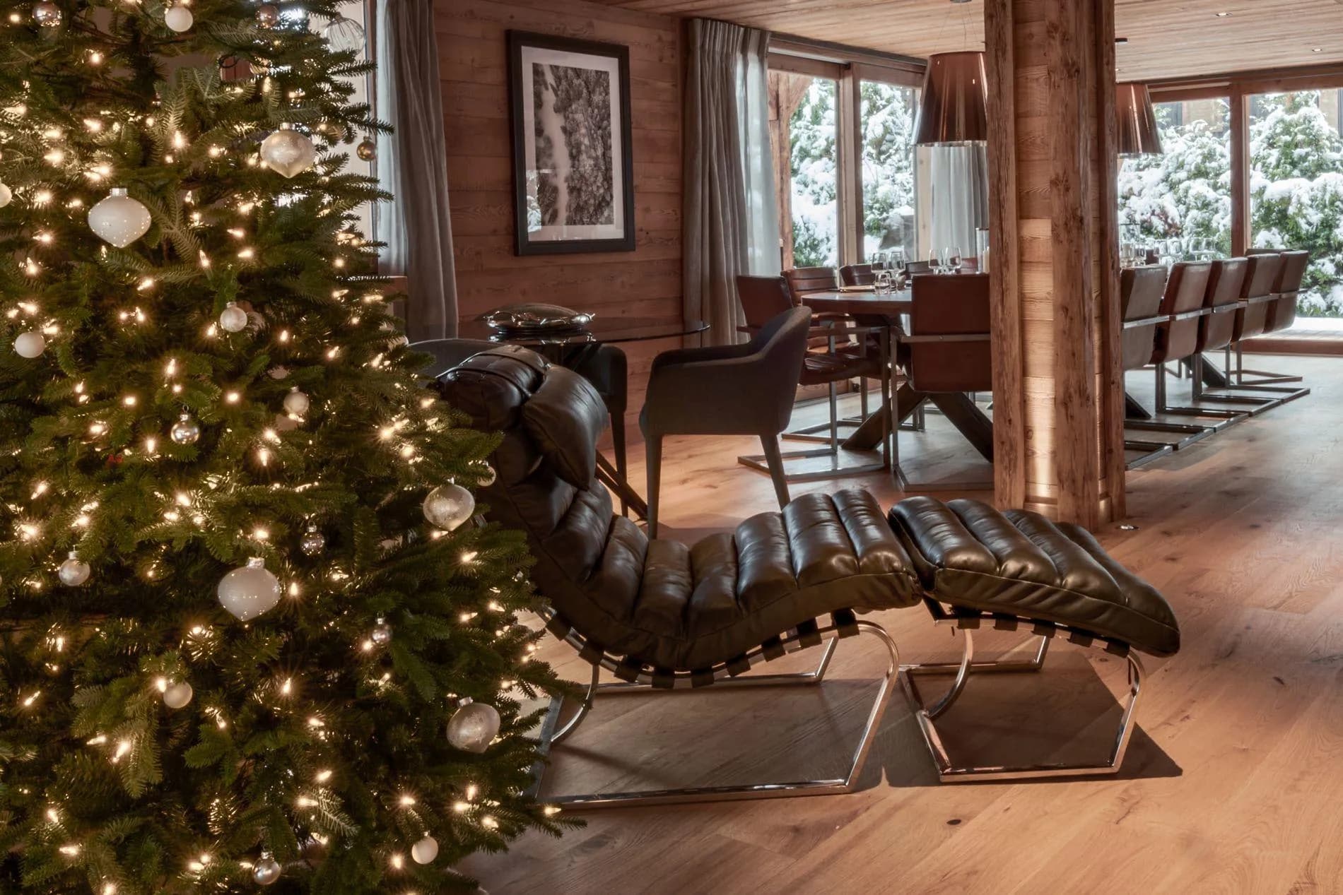 Open living area with leather lounger and dining seating for 10