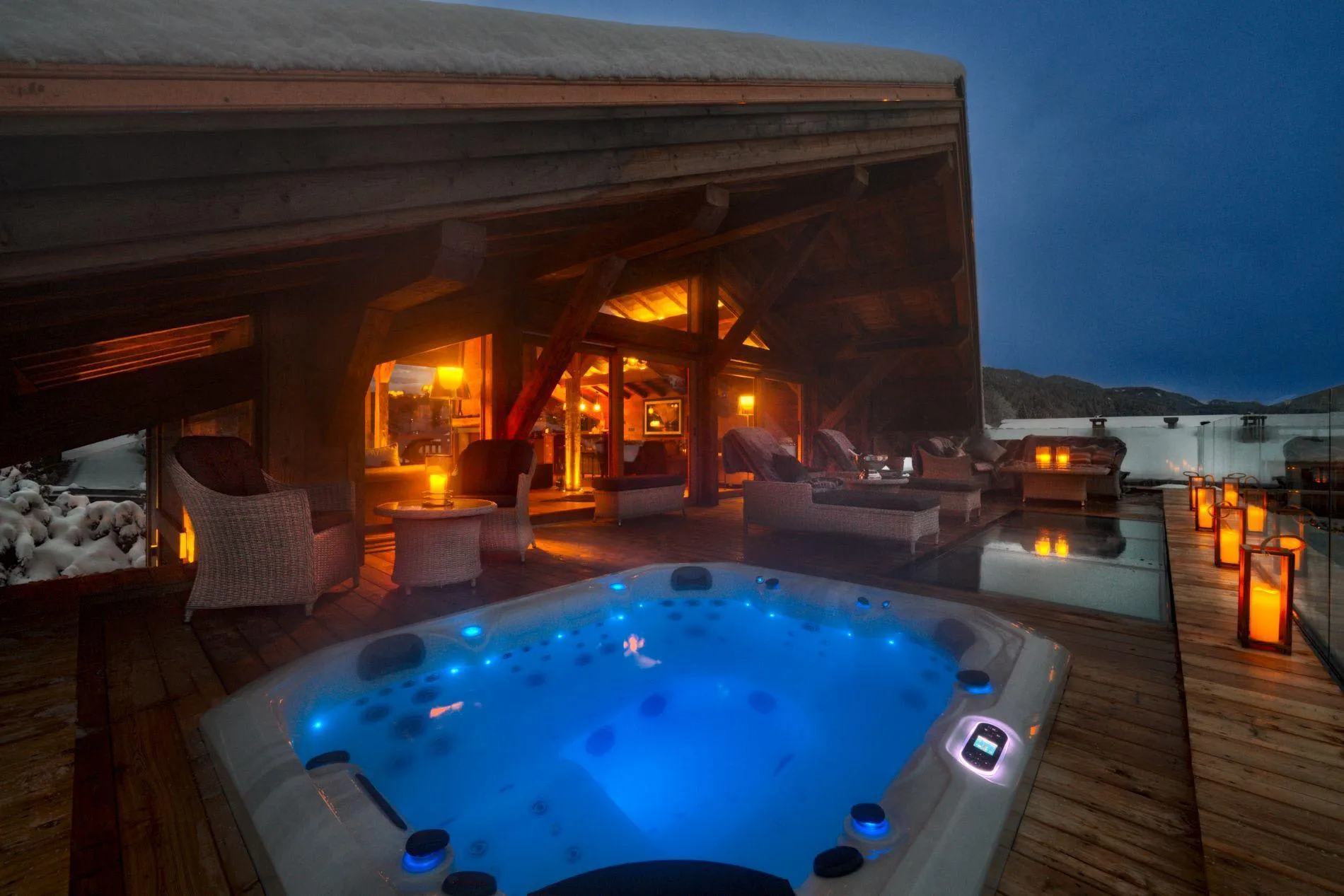Outdoor hot tub on the roof-top deck at dusk