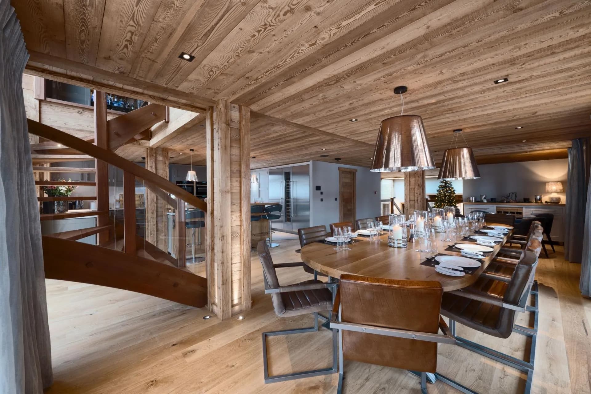 Dining area with seating for 12; adjacent to kitchen and spiral staircase