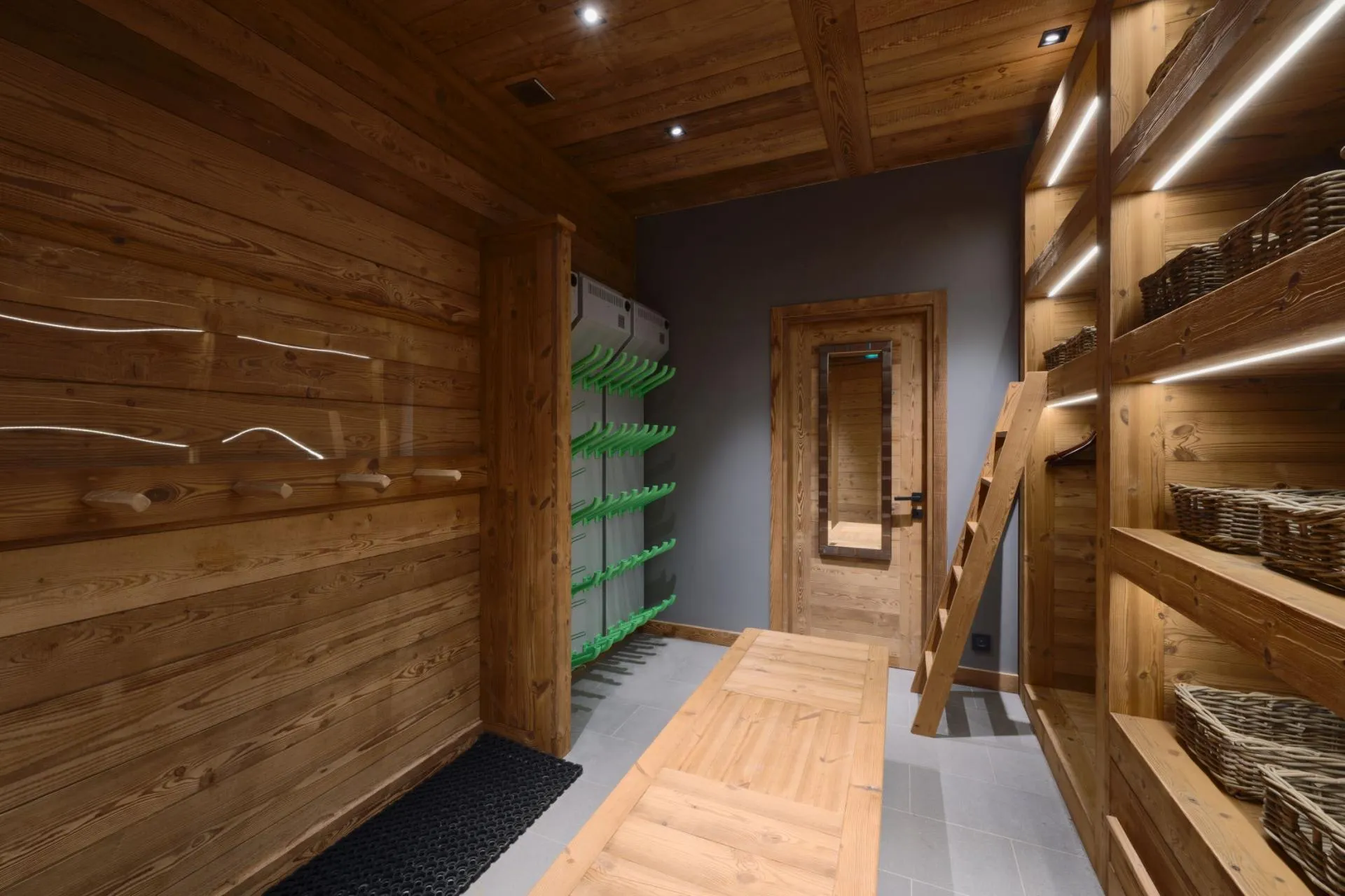 Ski room with heated boot racks and dedicated gear storage
