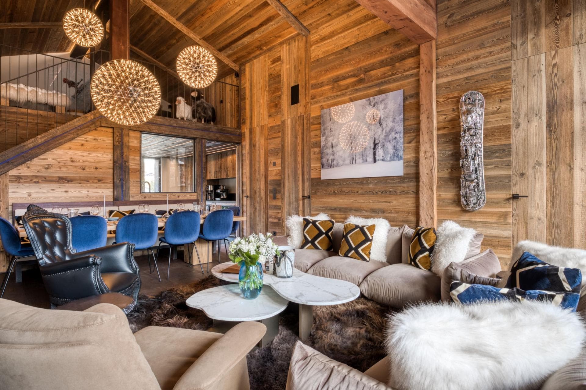 Open-plan living area with vaulted ceilings and dining seating for 10