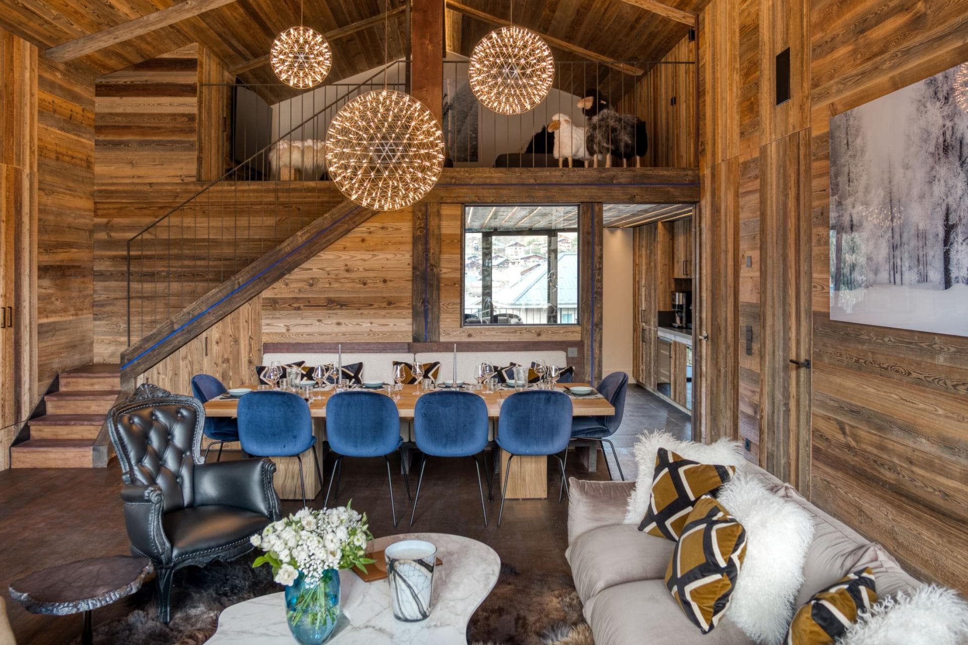 Open-plan living and dining area with mezzanine lounge and table seating for 10