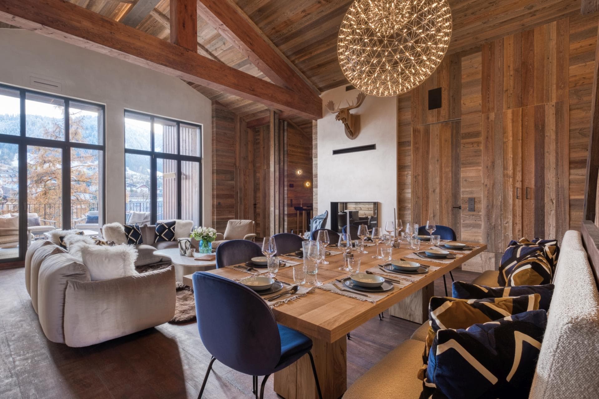 Open-plan dining area seats 10; adjacent living room with fireplace