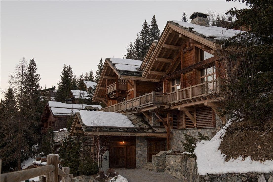 Multi-level timber chalet with private garage and wrap-around balconies
