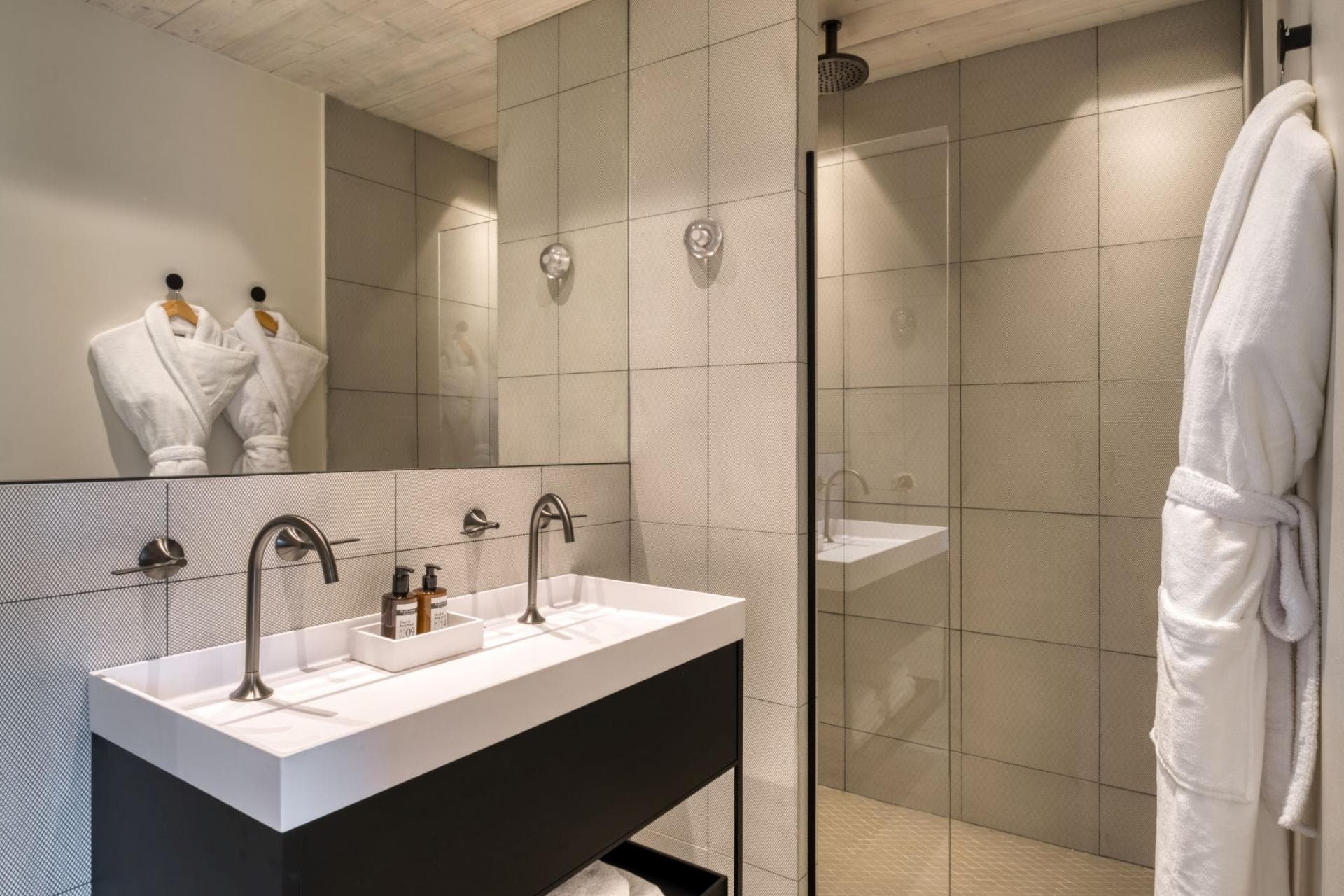 Bathroom with dual vanity and walk-in rain shower