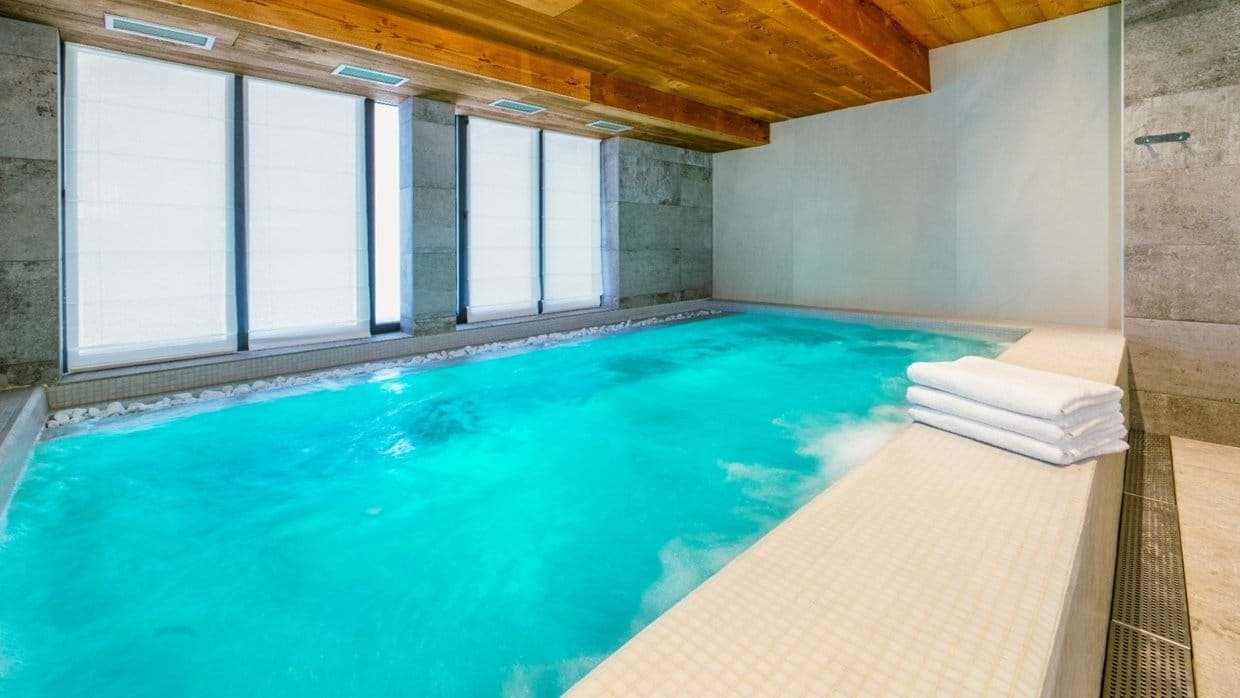 Indoor heated pool with hydrotherapy jets and privacy blinds
