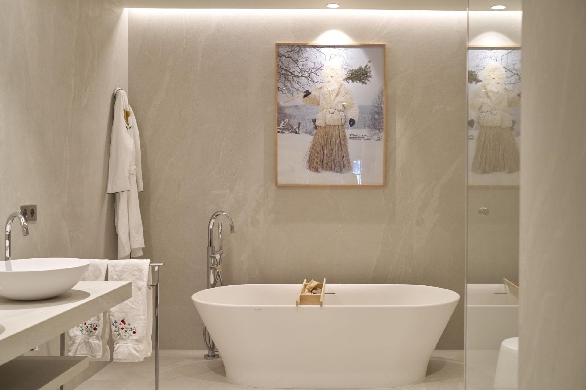 Bathroom with freestanding soaking tub and floor-mounted faucet