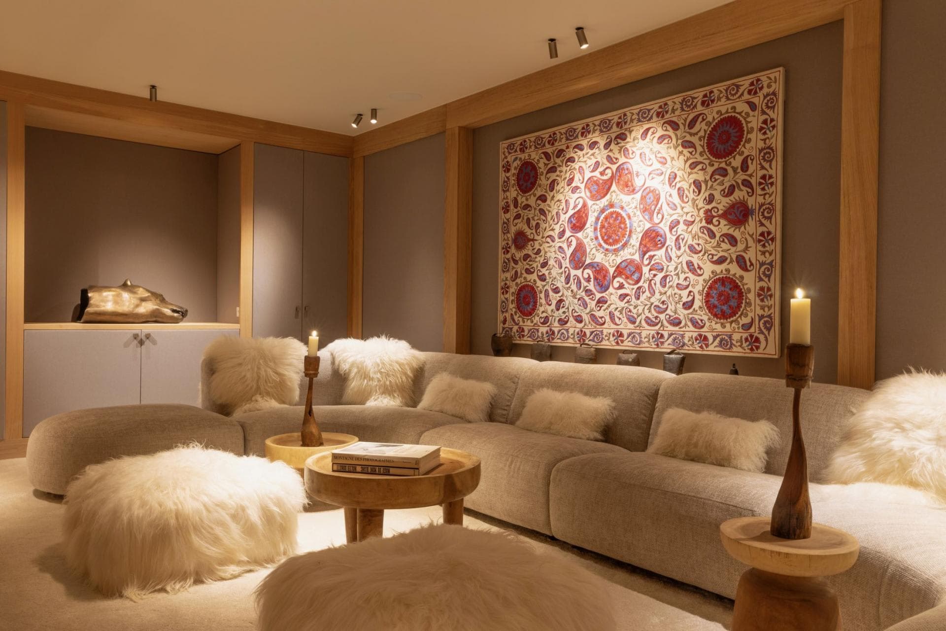 Media room with modular sectional seating and integrated gallery lighting