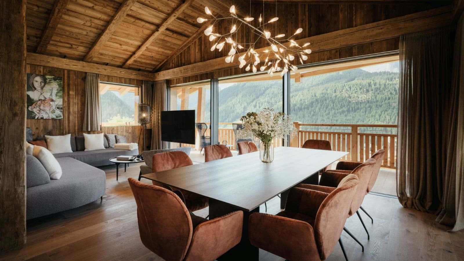 Open-plan dining area with seating for 8 and mountain valley views