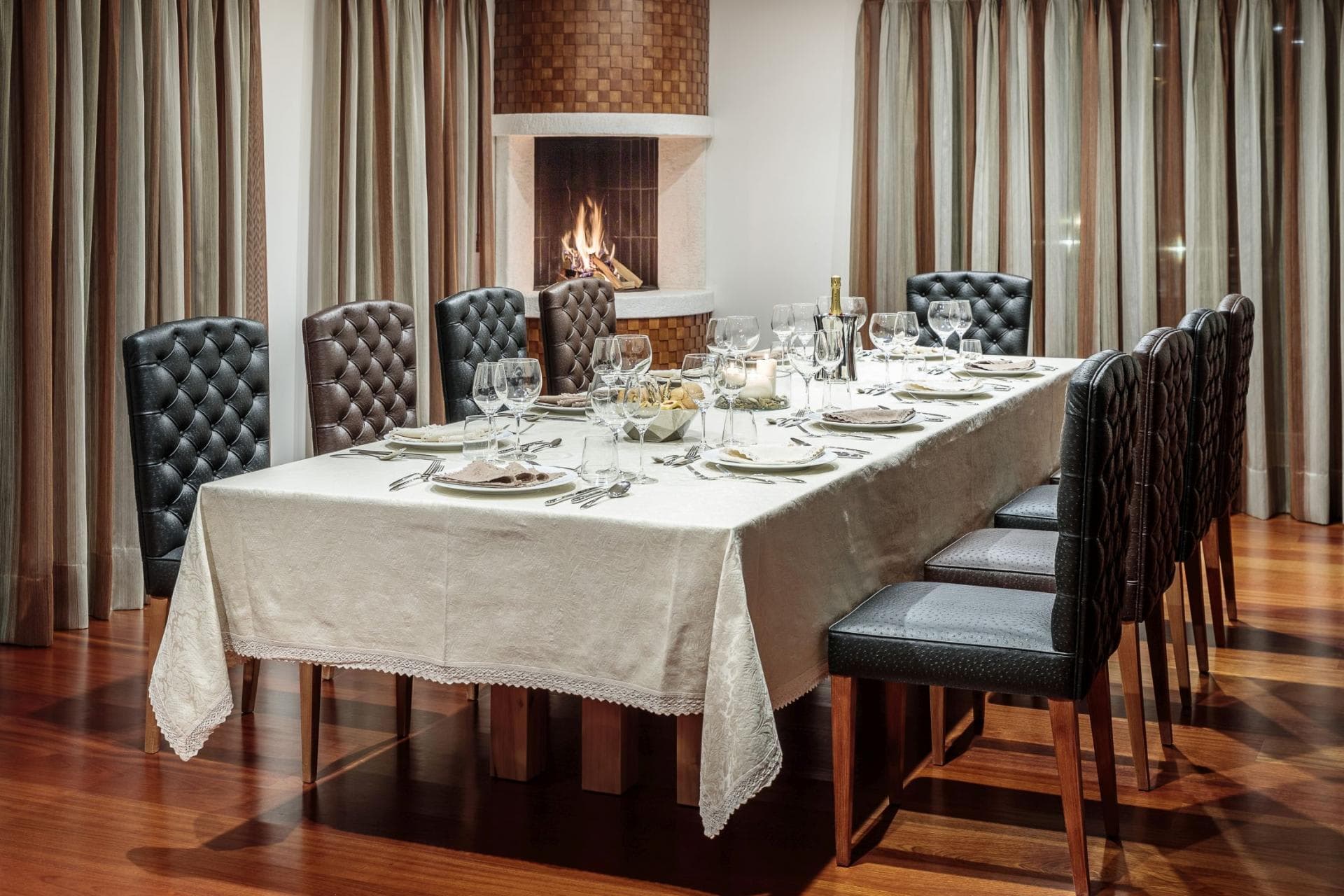 Dining table with seating for 10 and wood-burning corner fireplace
