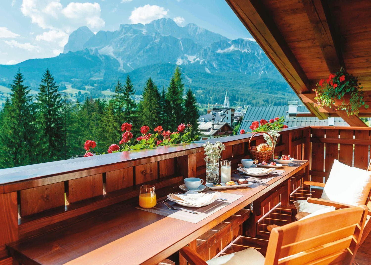 Covered balcony with built-in bar seating and panoramic mountain views