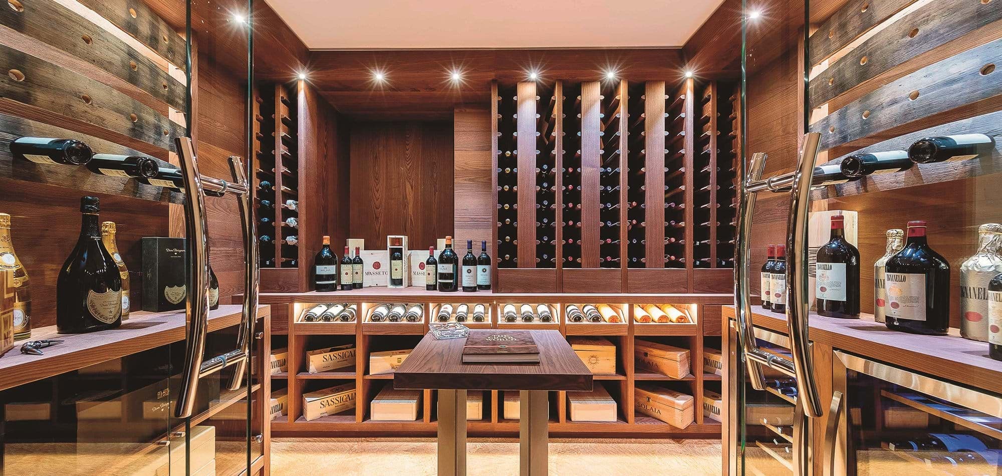 Temperature-controlled wine cellar with tasting table and custom wooden racking