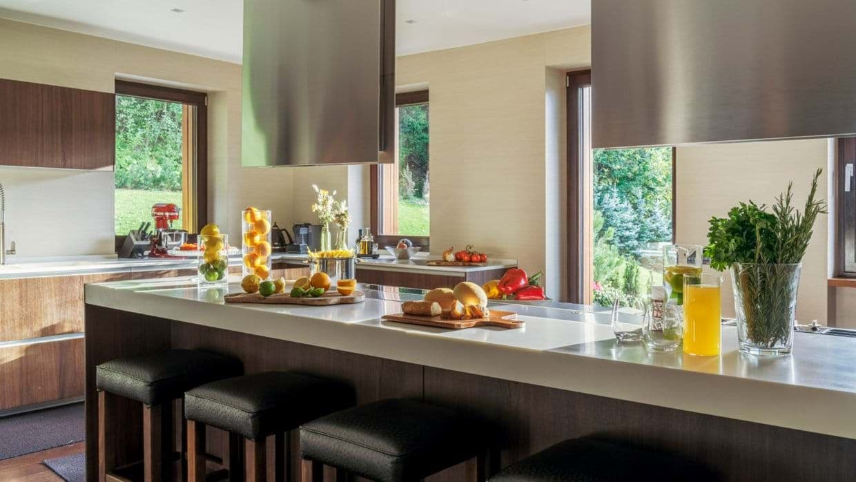 Kitchen island with breakfast bar seating for four and garden views