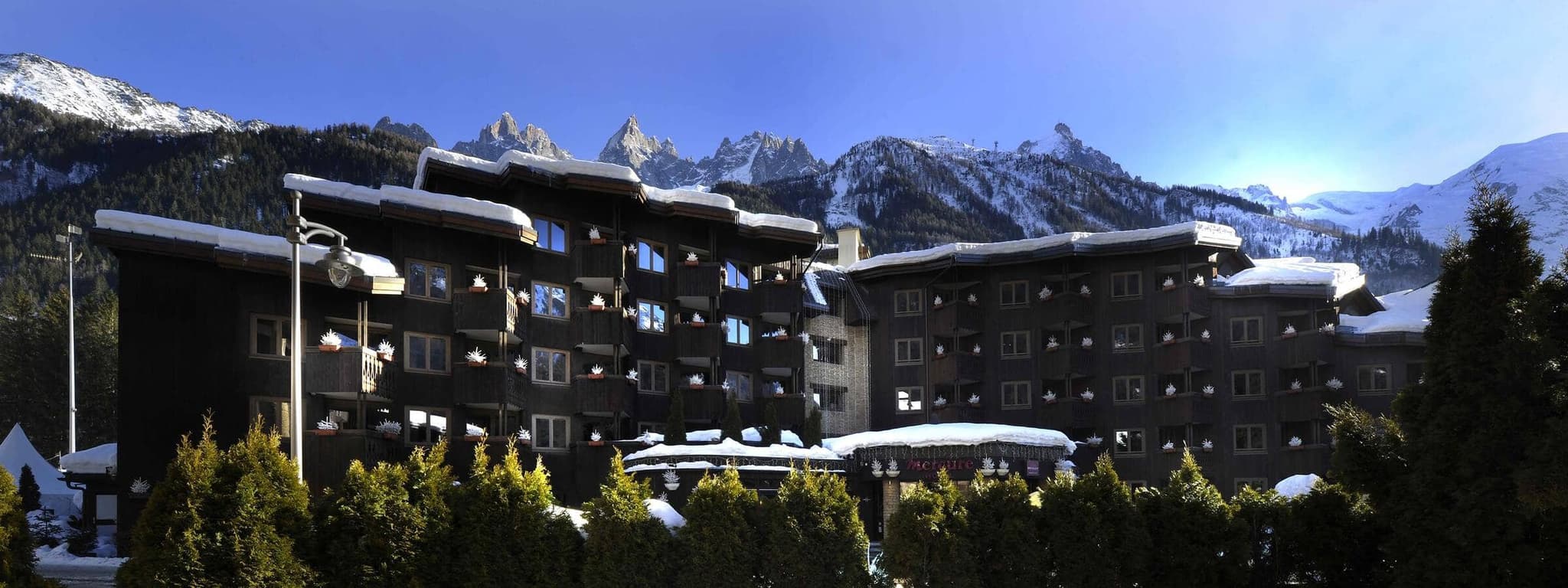 Ski-in/ski-out chalet exterior with private balconies and Mont Blanc views