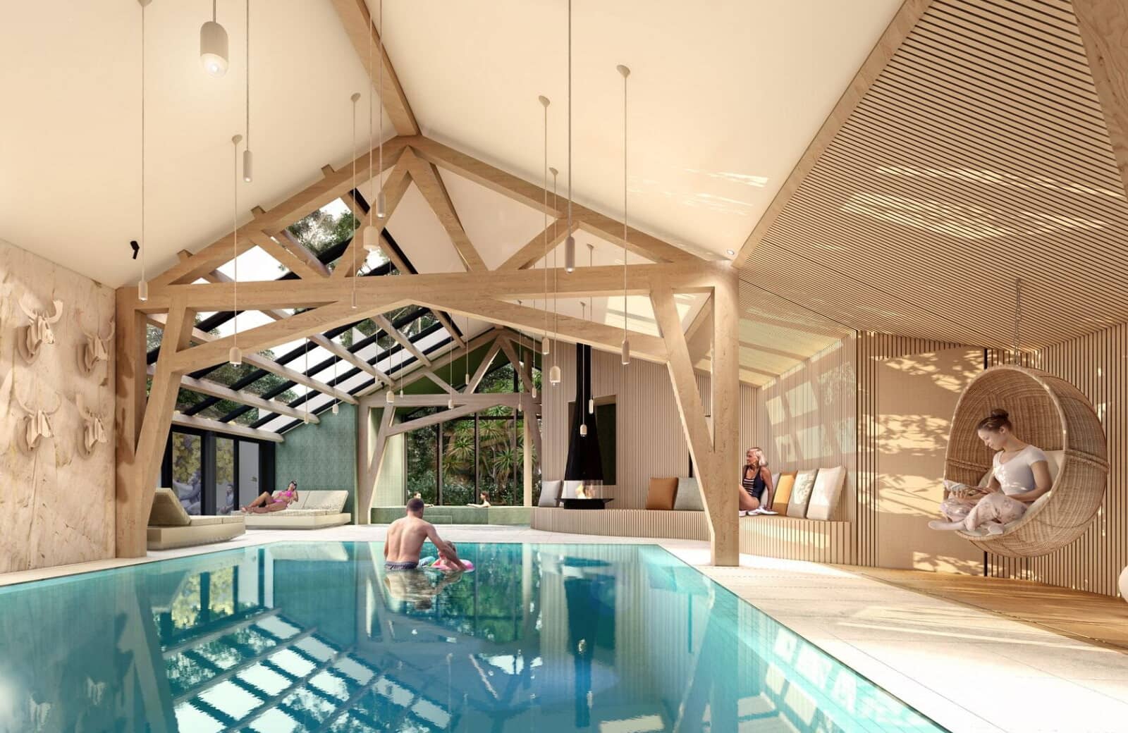 Indoor heated pool with wood-beam ceiling and hanging egg chair