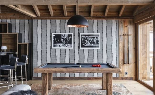 Game room with regulation-size pool table and adjacent wet bar