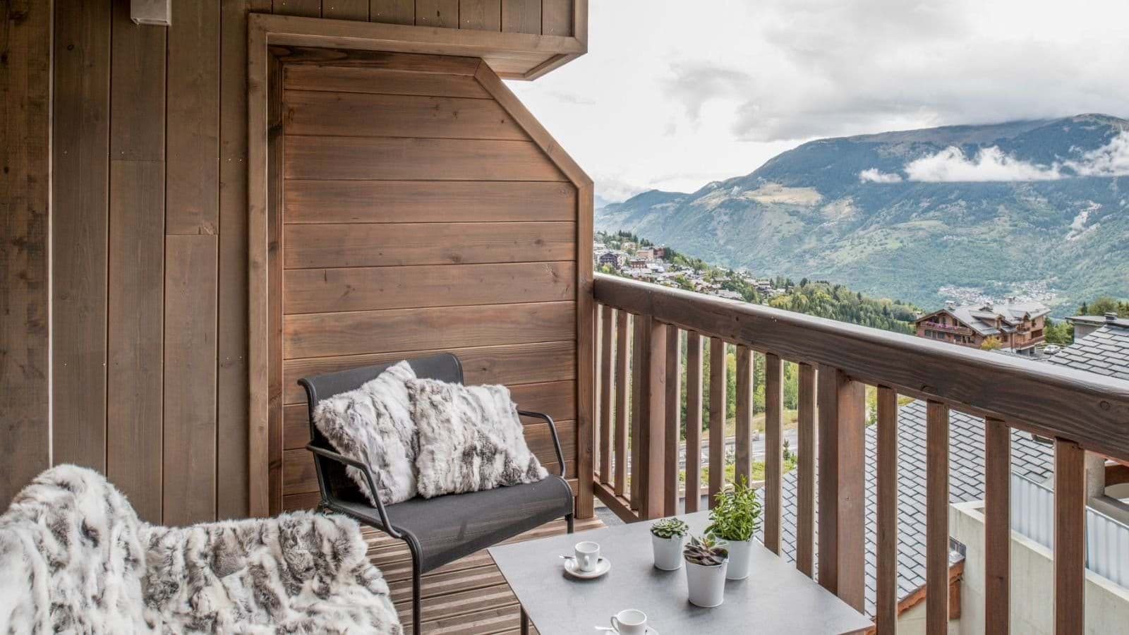 Private balcony with valley views and seating for two