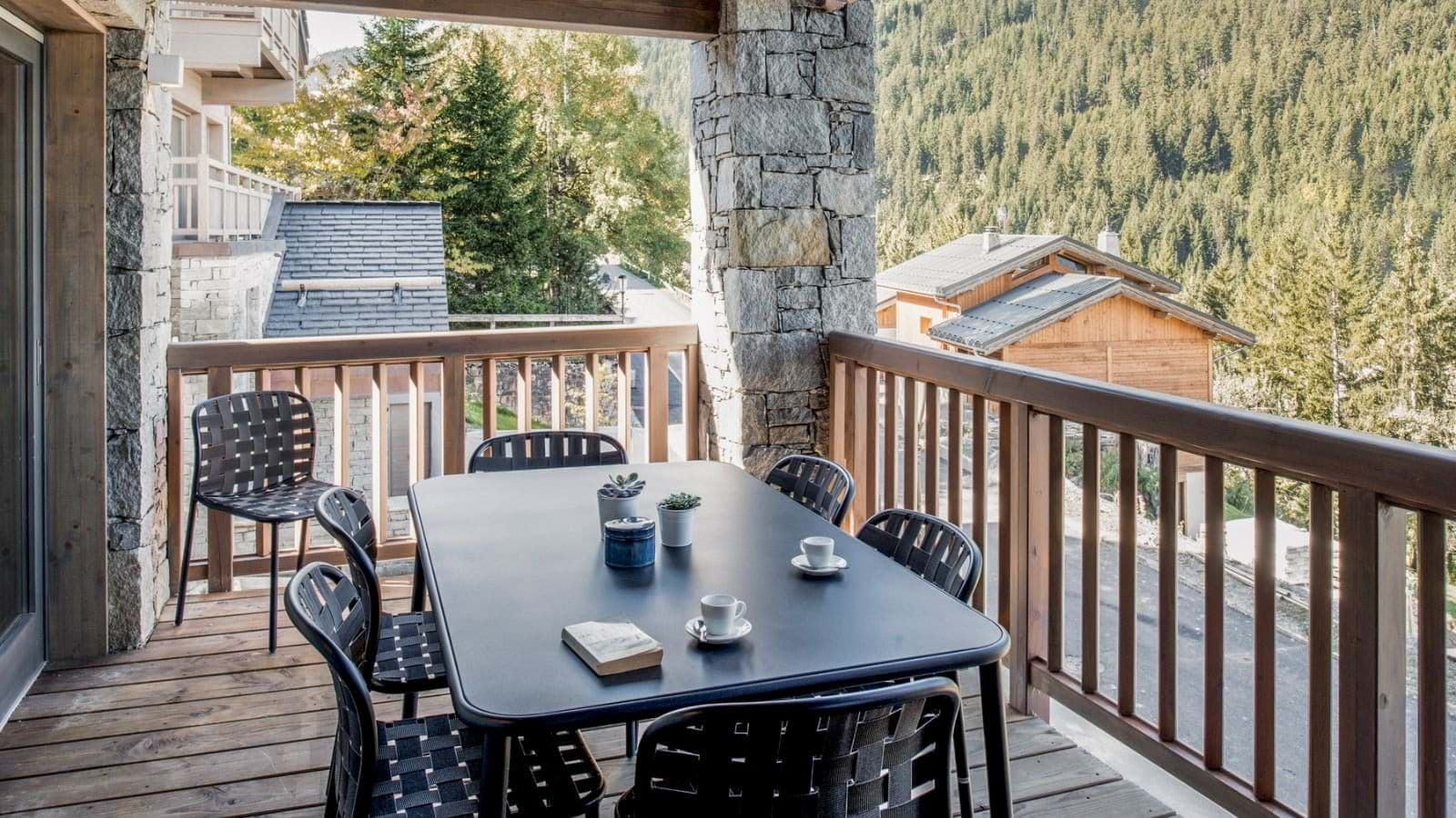 Covered terrace with dining seating for 6 and valley views