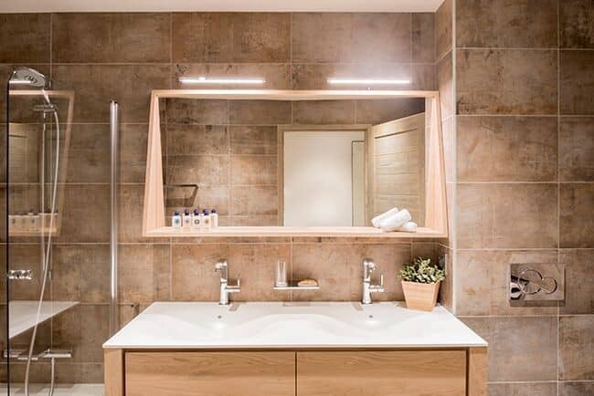 Bathroom with dual vanity and walk-in shower