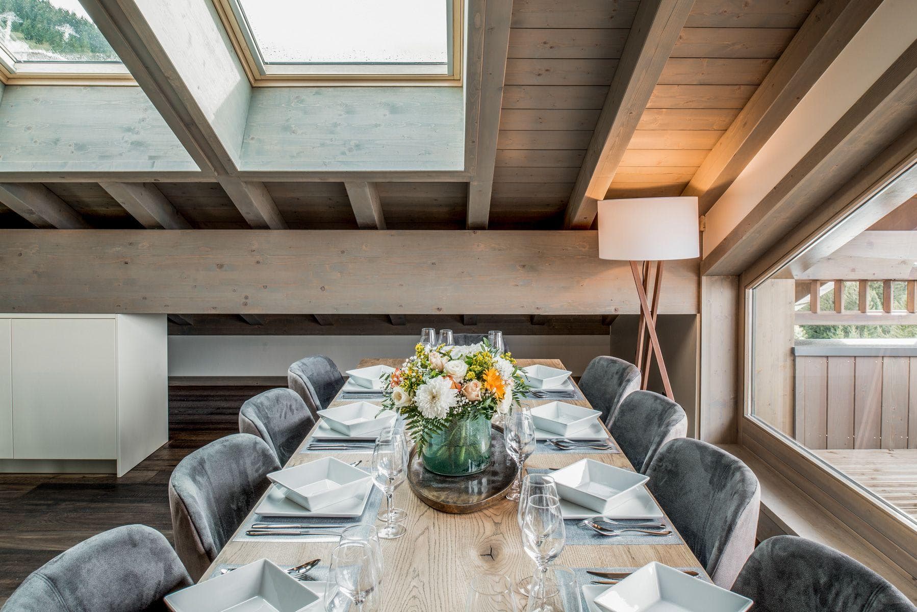 Dining area with seating for 10 under vaulted skylights
