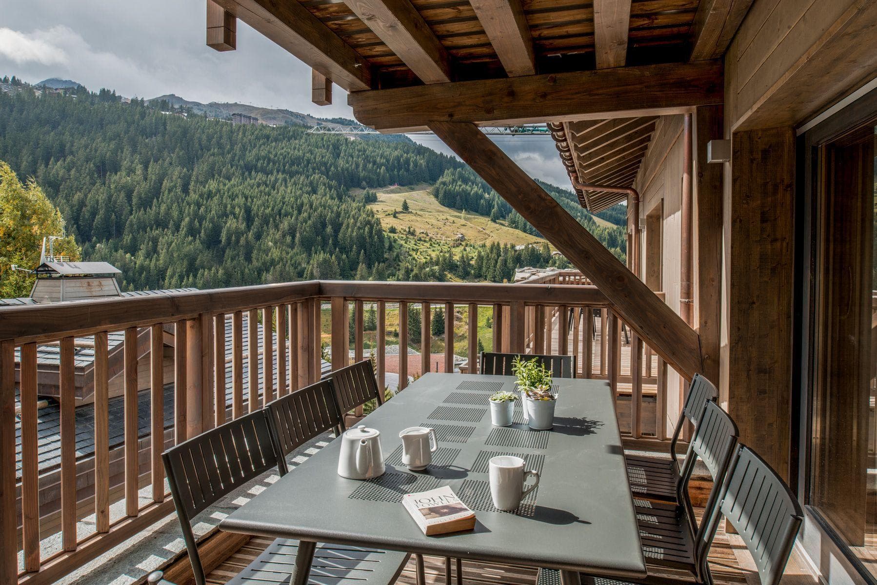 Covered balcony with seating for 6; views of mountain slopes