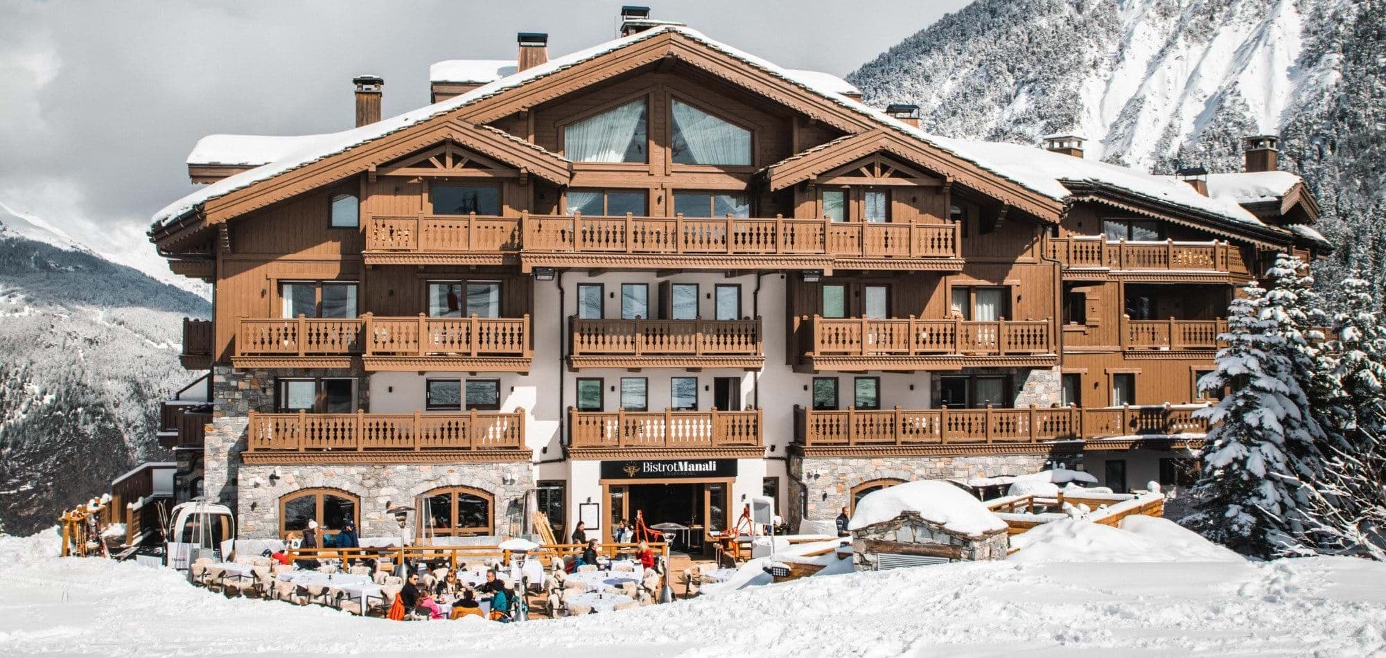 Ski-in/ski-out chalet exterior with private balconies and mountain-facing terrace