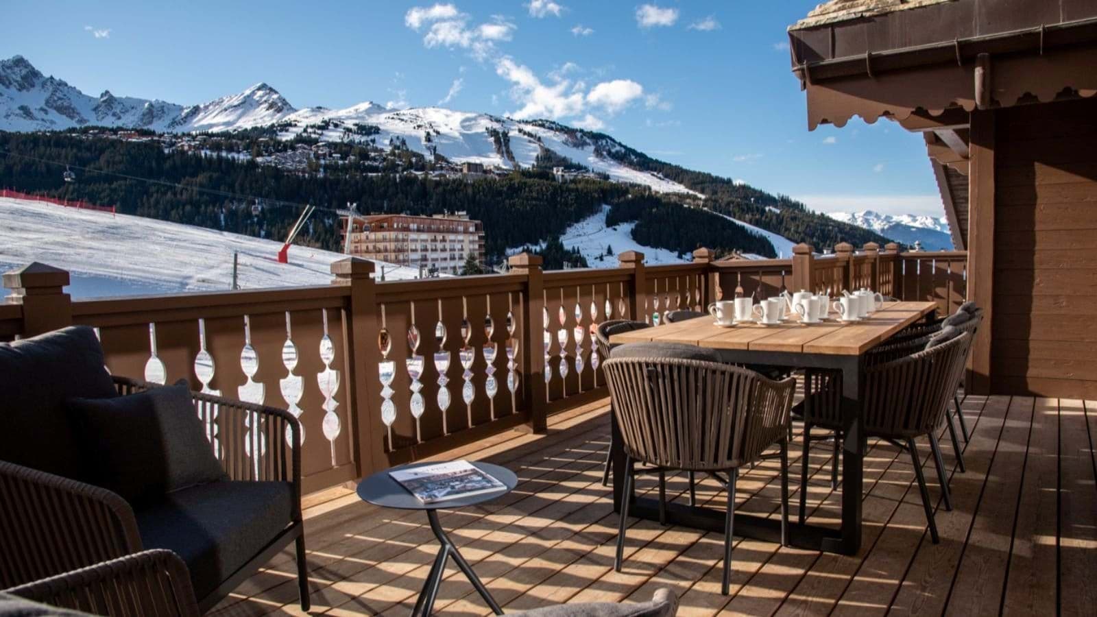 Private balcony with outdoor dining for 8 and ski-in/ski-out views