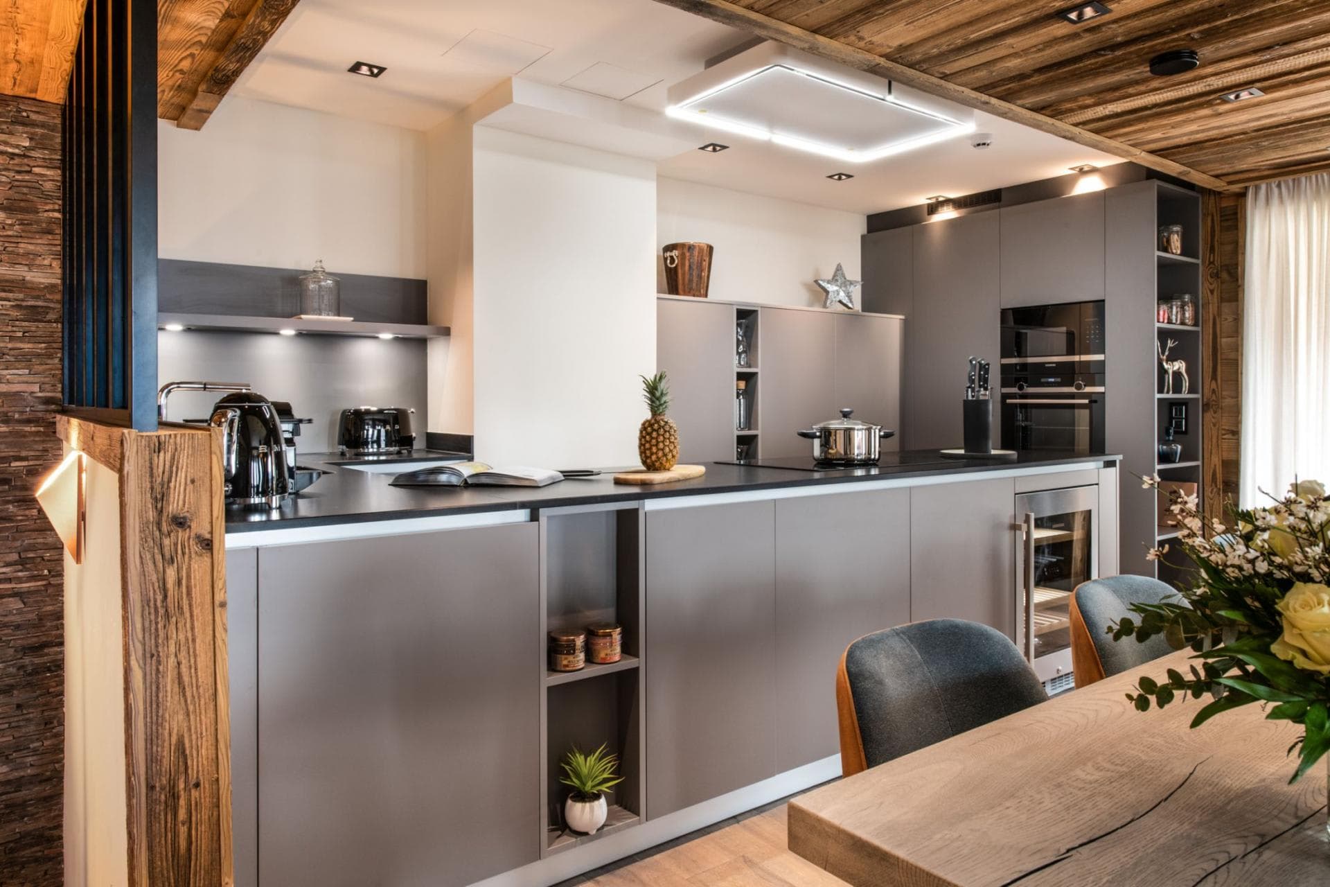 Kitchen island with induction cooktop and built-in wine fridge
