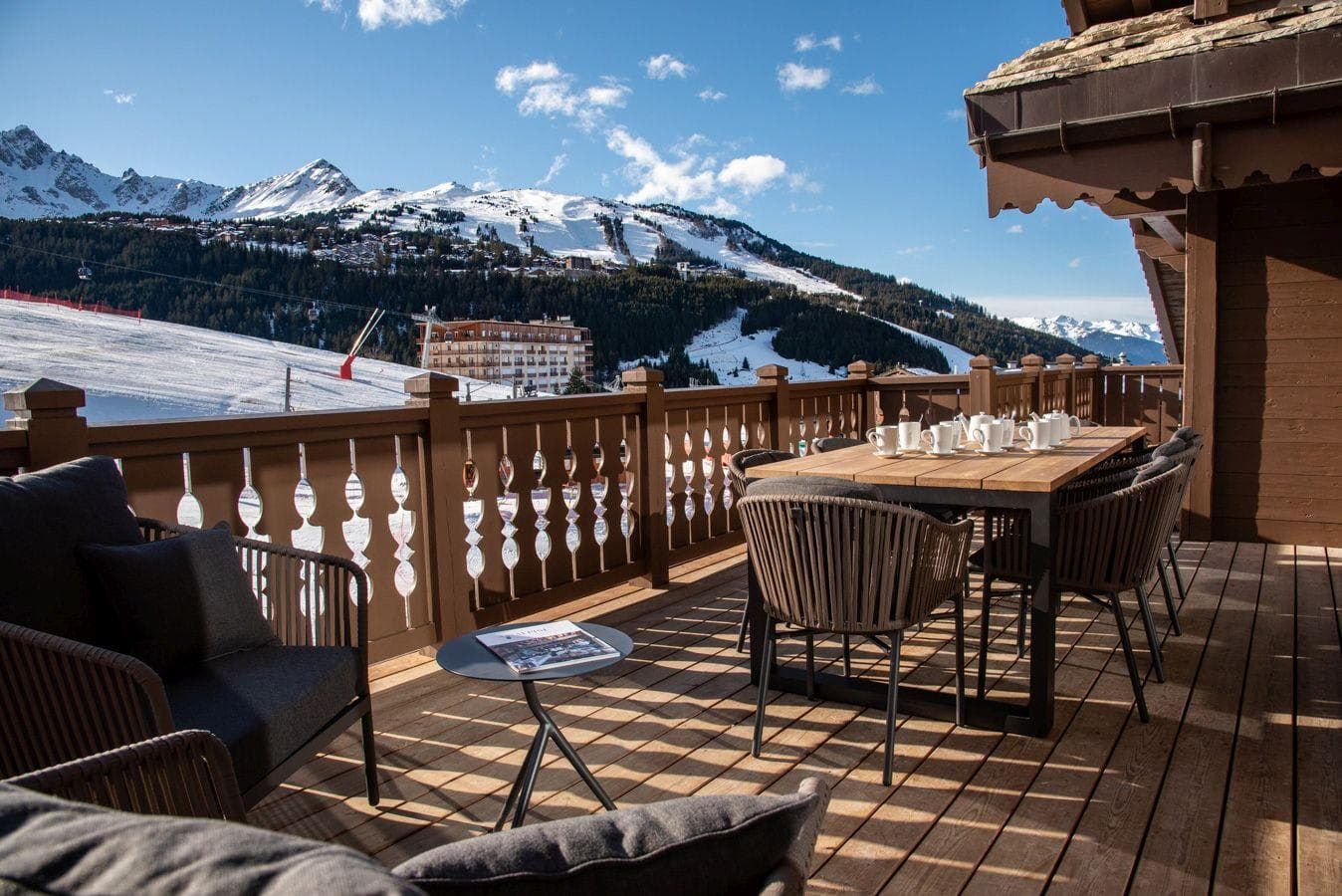 Private deck with dining for 8 and ski-in/ski-out mountain views