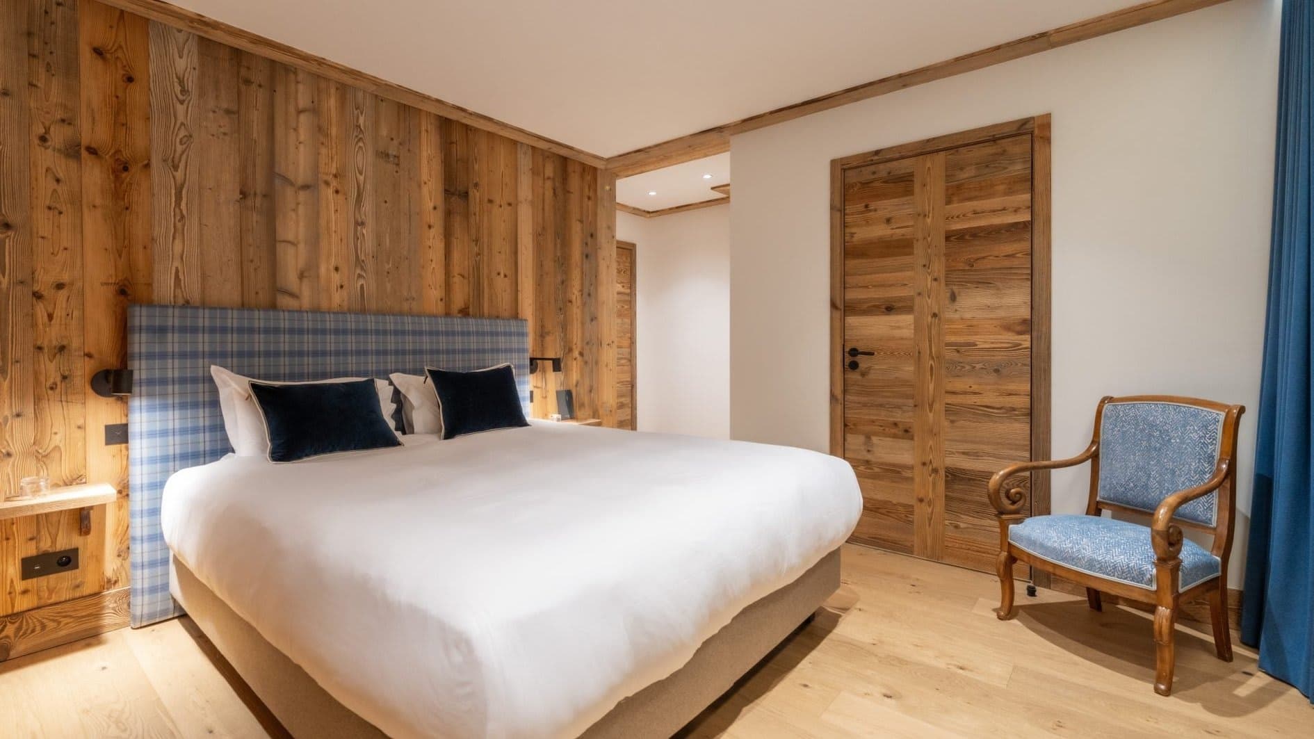 Bedroom with king bed and reclaimed wood accent wall