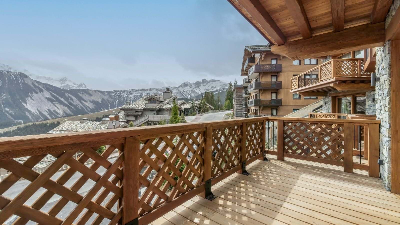 Private wooden balcony with views of the French Alps and Courchevel village