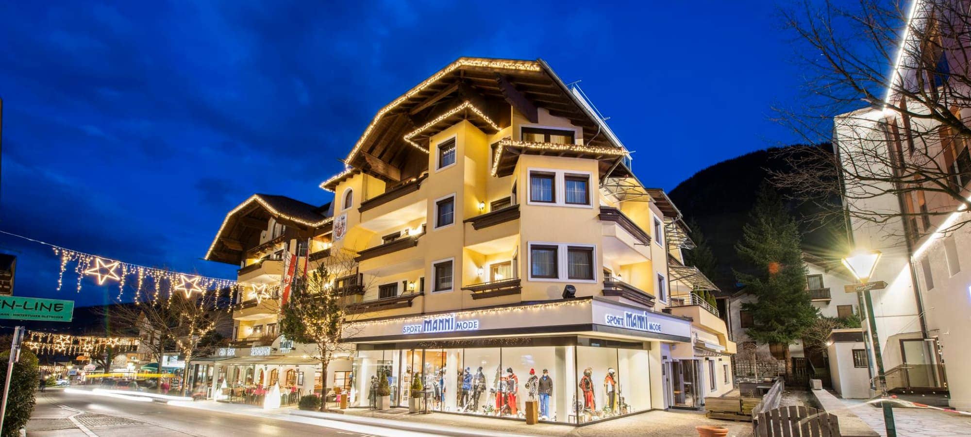 Chalet exterior with ground-floor sports shop; central village location