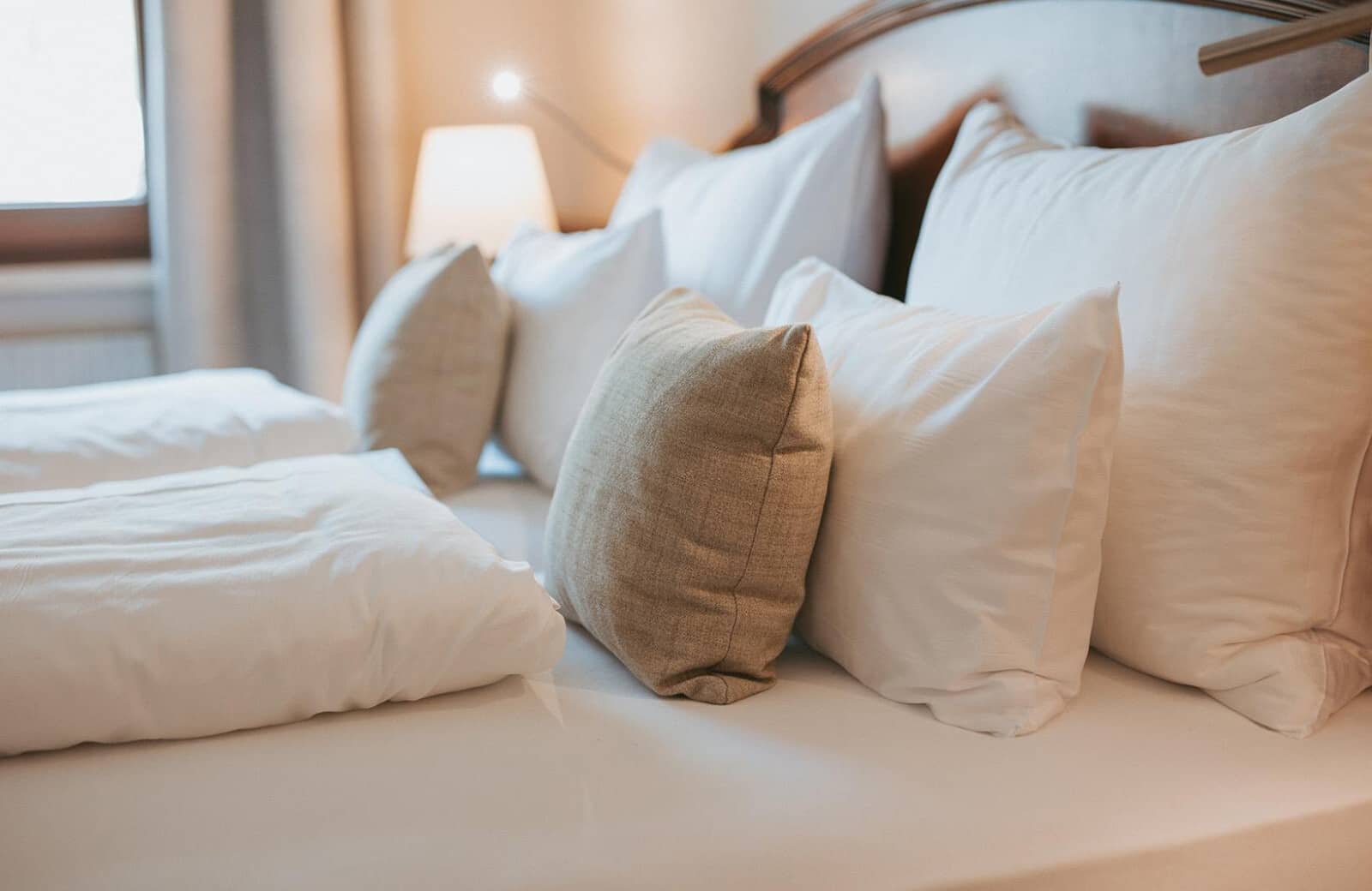 Bedroom with separate duvets and adjustable bedside reading lamp