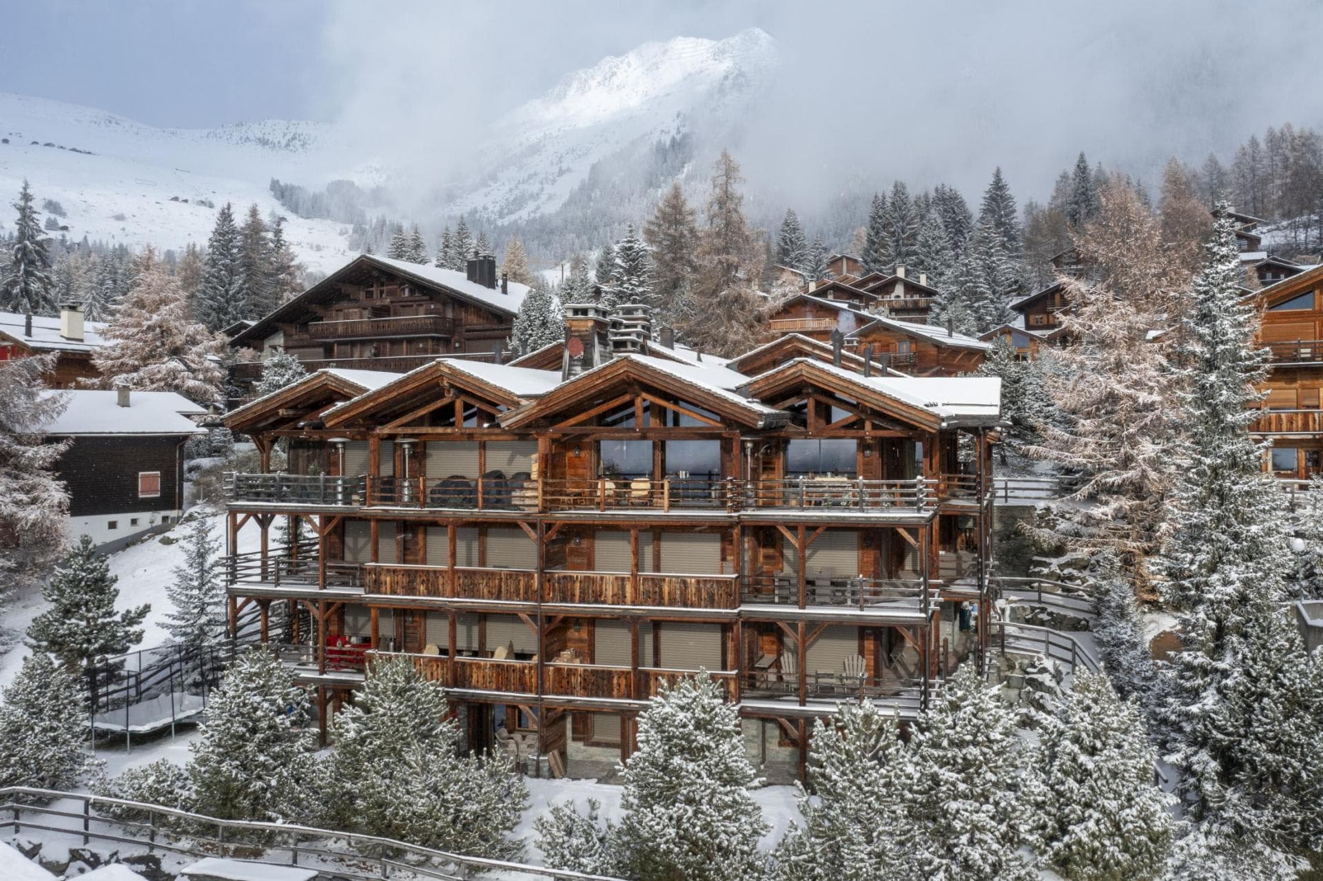 Ski-in, ski-out timber chalet with private balconies and mountain views