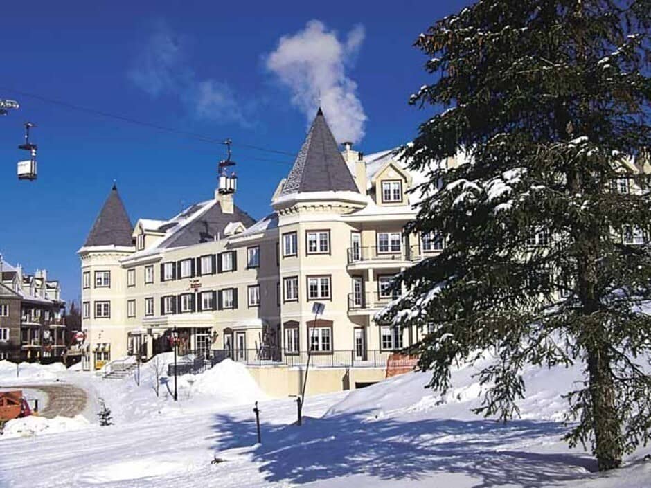 Ski-in, ski-out resort exterior located directly beside the gondola lift